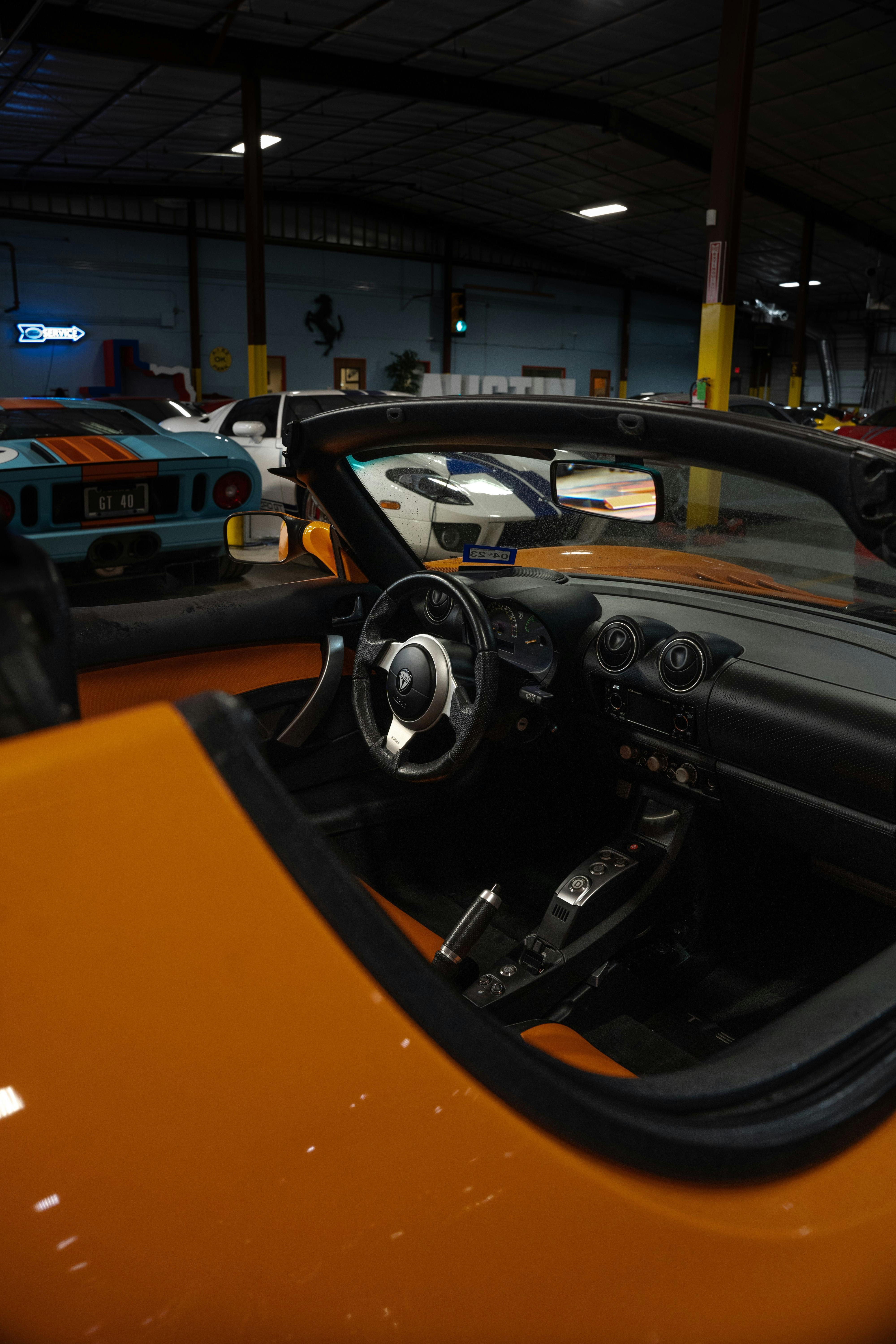 Black interior on a 2010 Very Orange Metallic Tesla Roadster in Austin, TX.