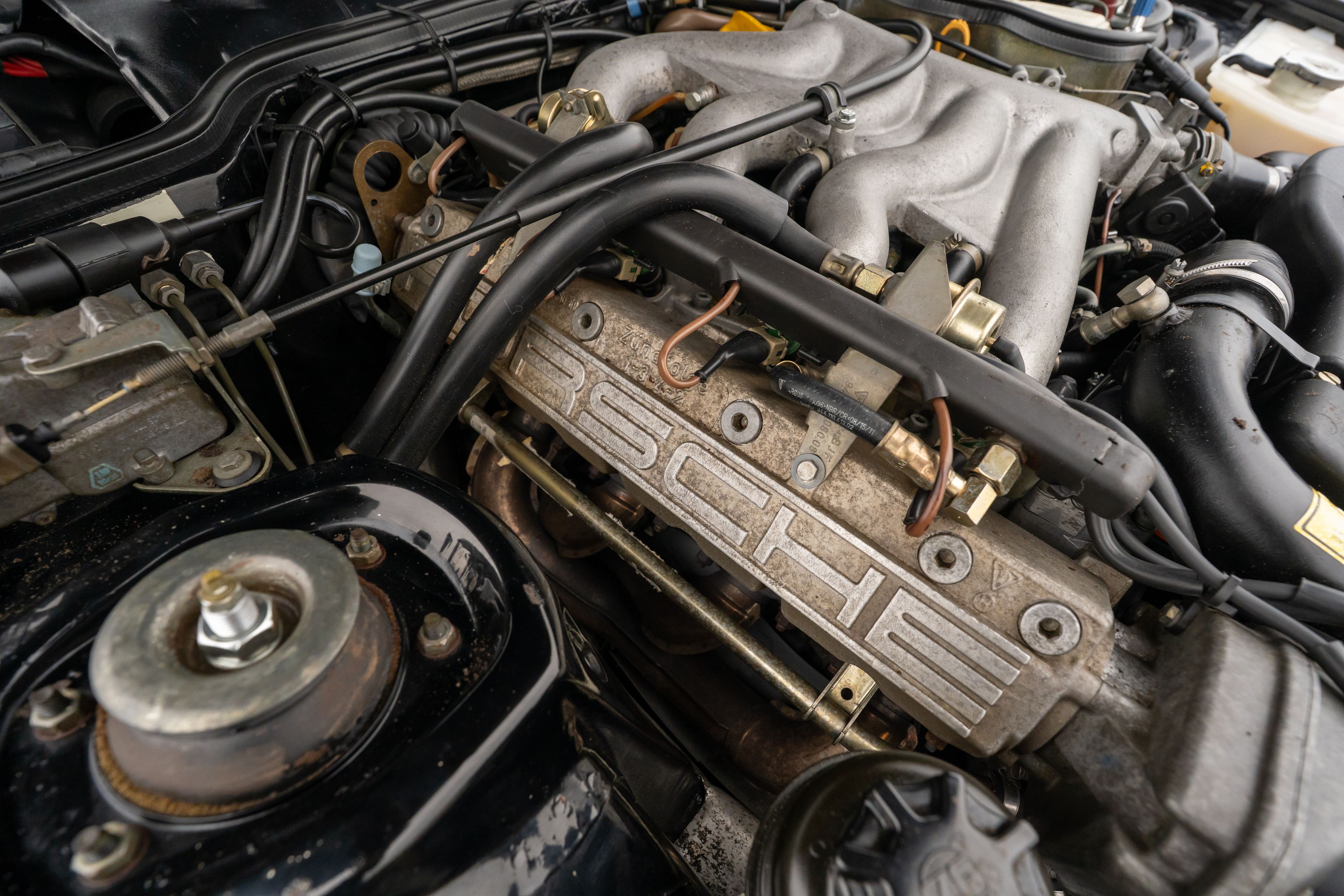 1986 Porsche 944 Turbo engine bay in Black on Black in Lakeway, TX.