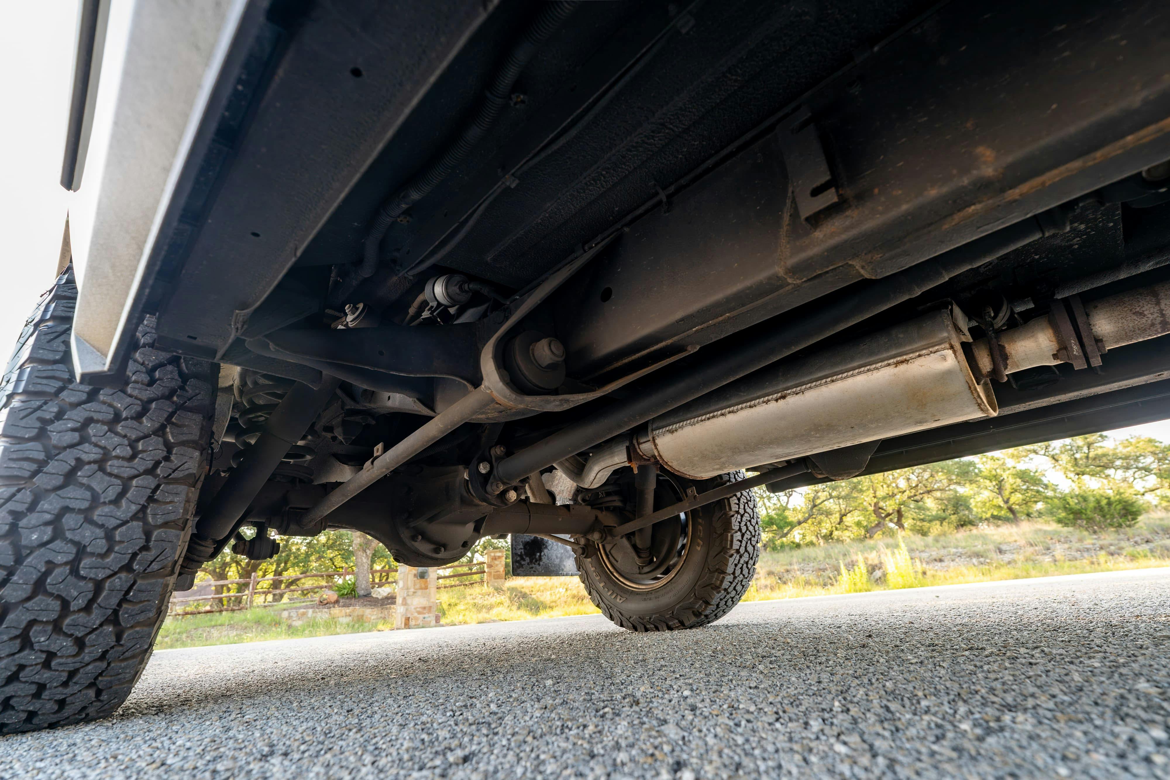 Undercarriage of a 1995 White Land Rover Range Rover County Long Wheel Base in Austin, TX.