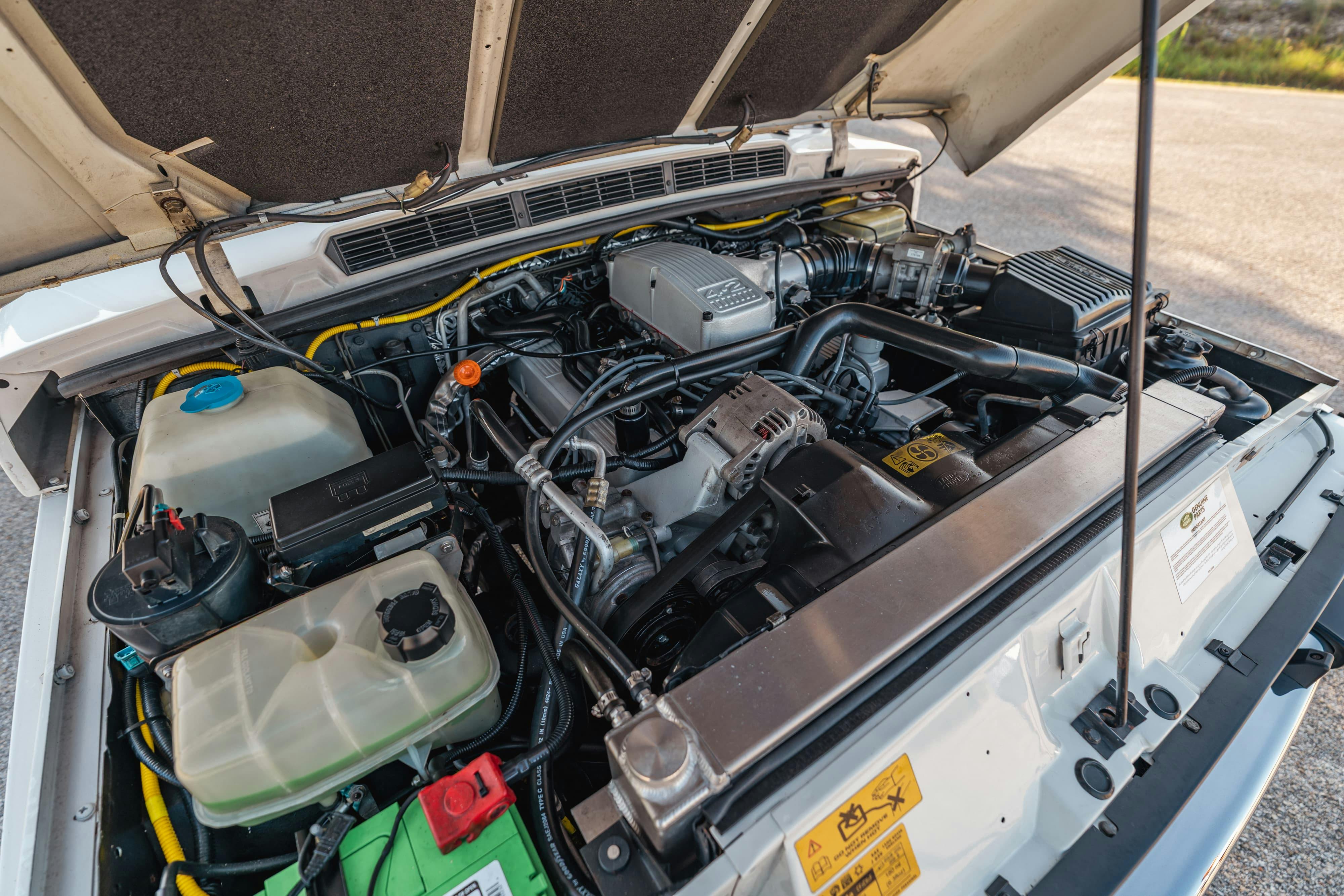 Engine bay of a 4.6 swapped 1995 White Land Rover Range Rover County Long Wheel Base in Austin, TX.
