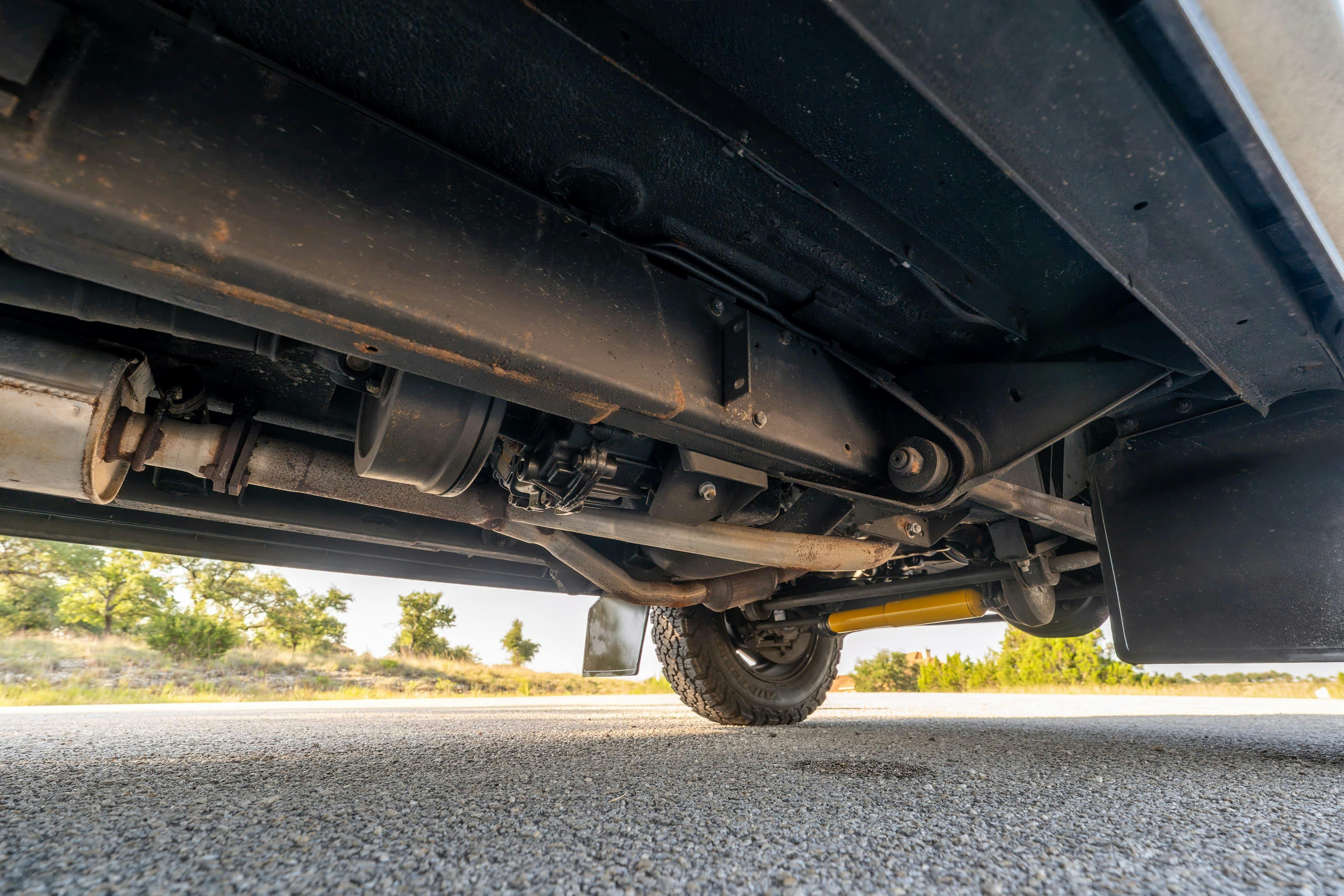 Undercarriage of a 1995 White Land Rover Range Rover County Long Wheel Base in Austin, TX.