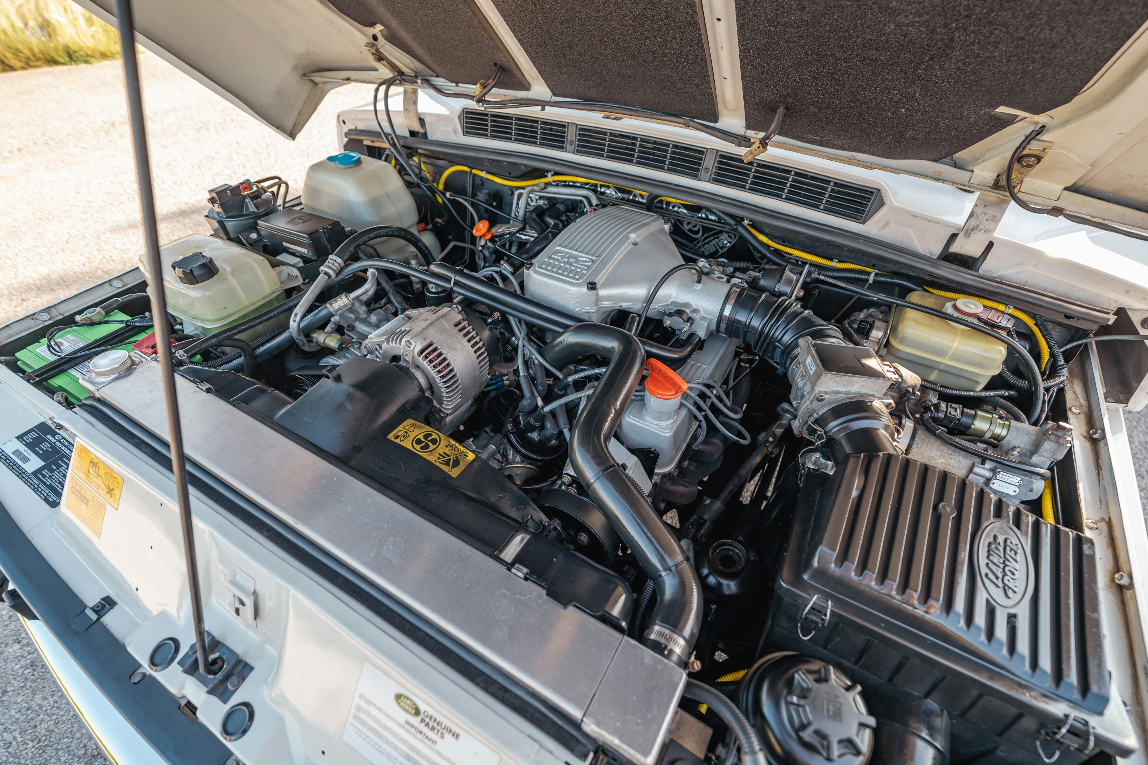 Engine bay of a 4.6 swapped 1995 White Land Rover Range Rover County Long Wheel Base in Austin, TX.