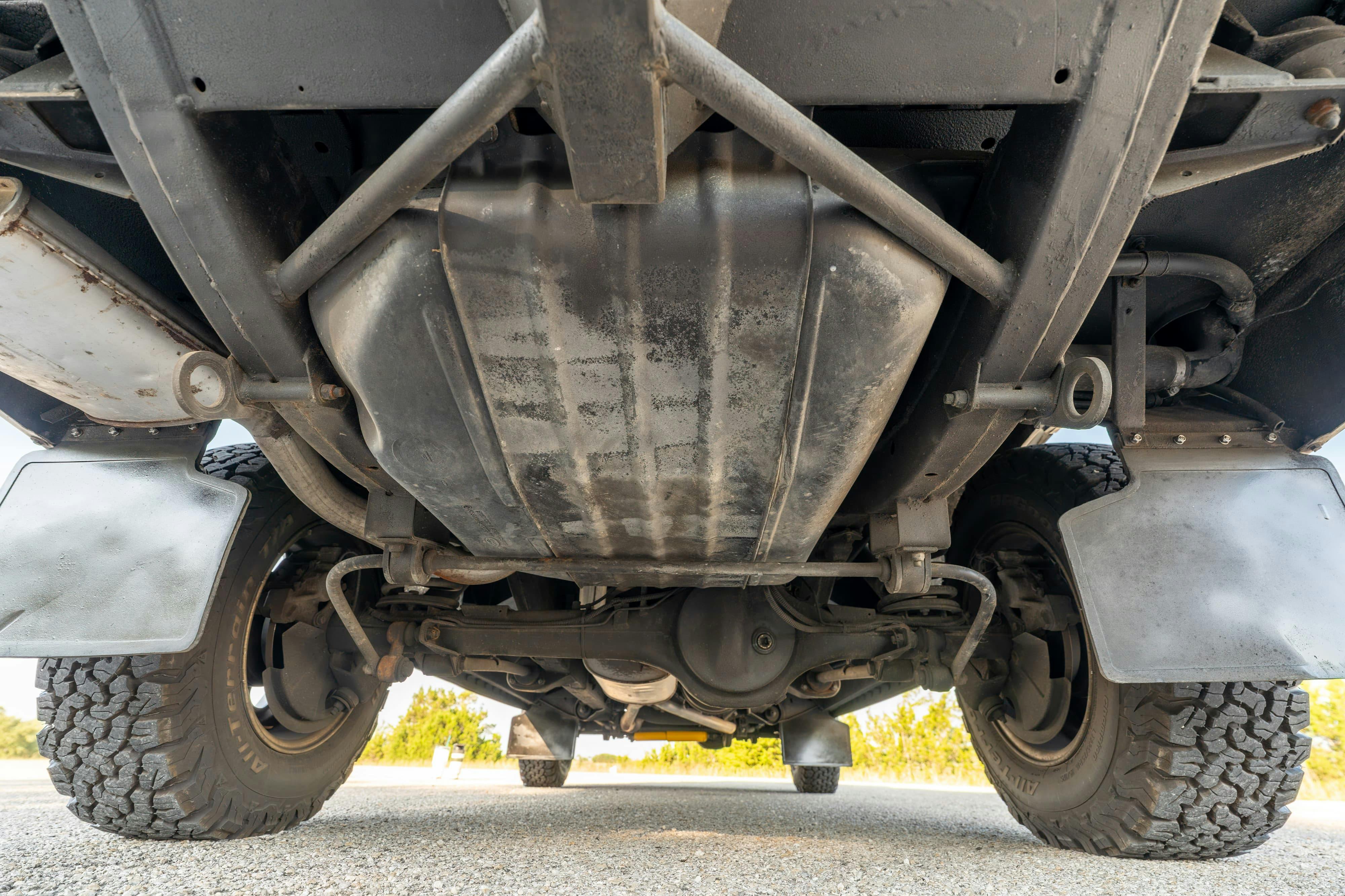 Undercarriage of a 1995 White Land Rover Range Rover County Long Wheel Base in Austin, TX.