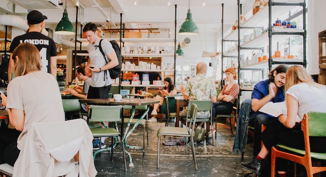 Busy scene inside of a campus coffee shop