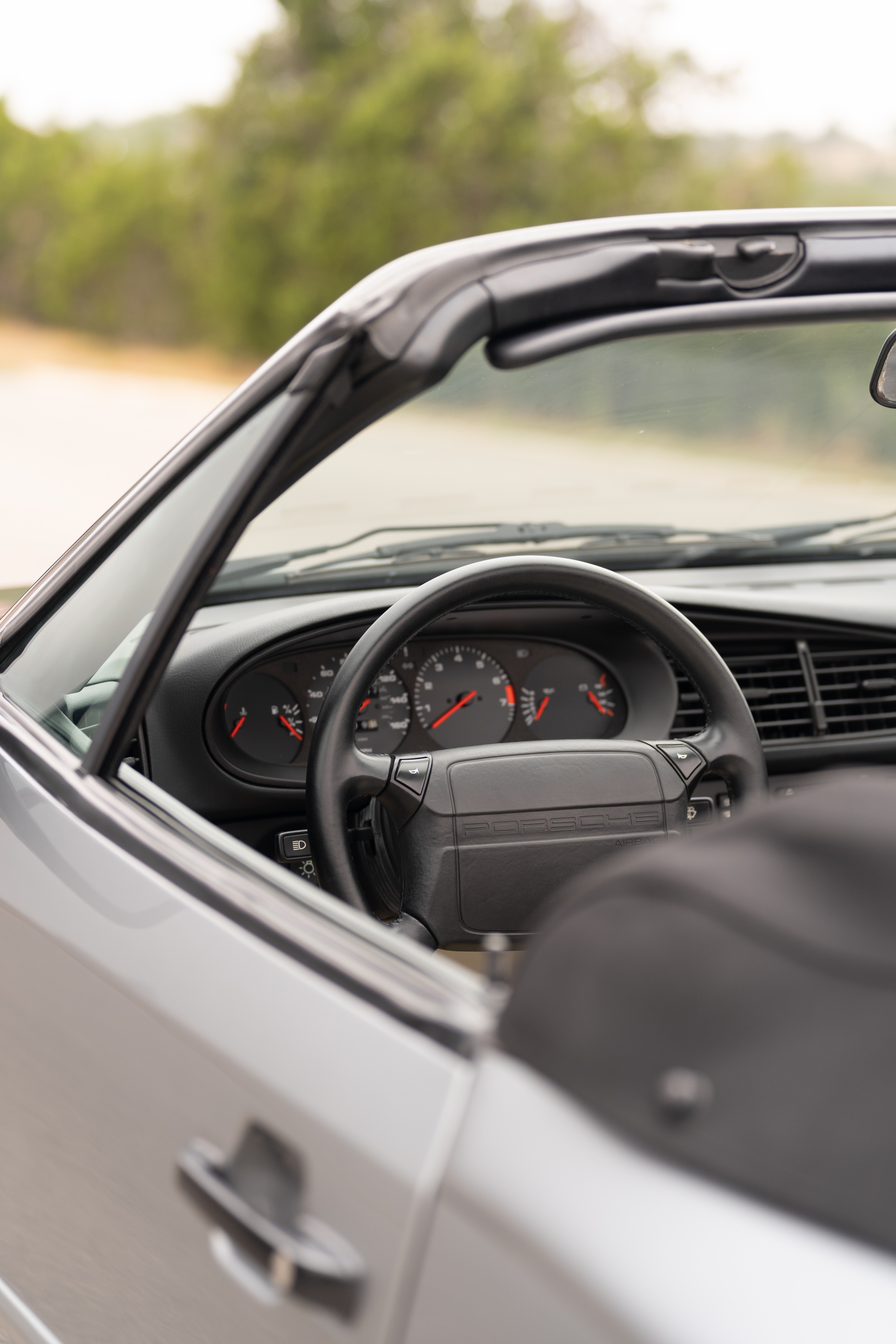 Gauge cluster on a Titanium Metallic 1990 Porsche 944 S2 Cabriolet 5-Speed shot in Austin, TX.