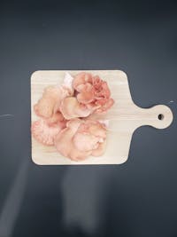 Pink Oyster Mushrooms on a cutting board