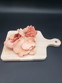 Pink Oyster Mushrooms on a cutting board