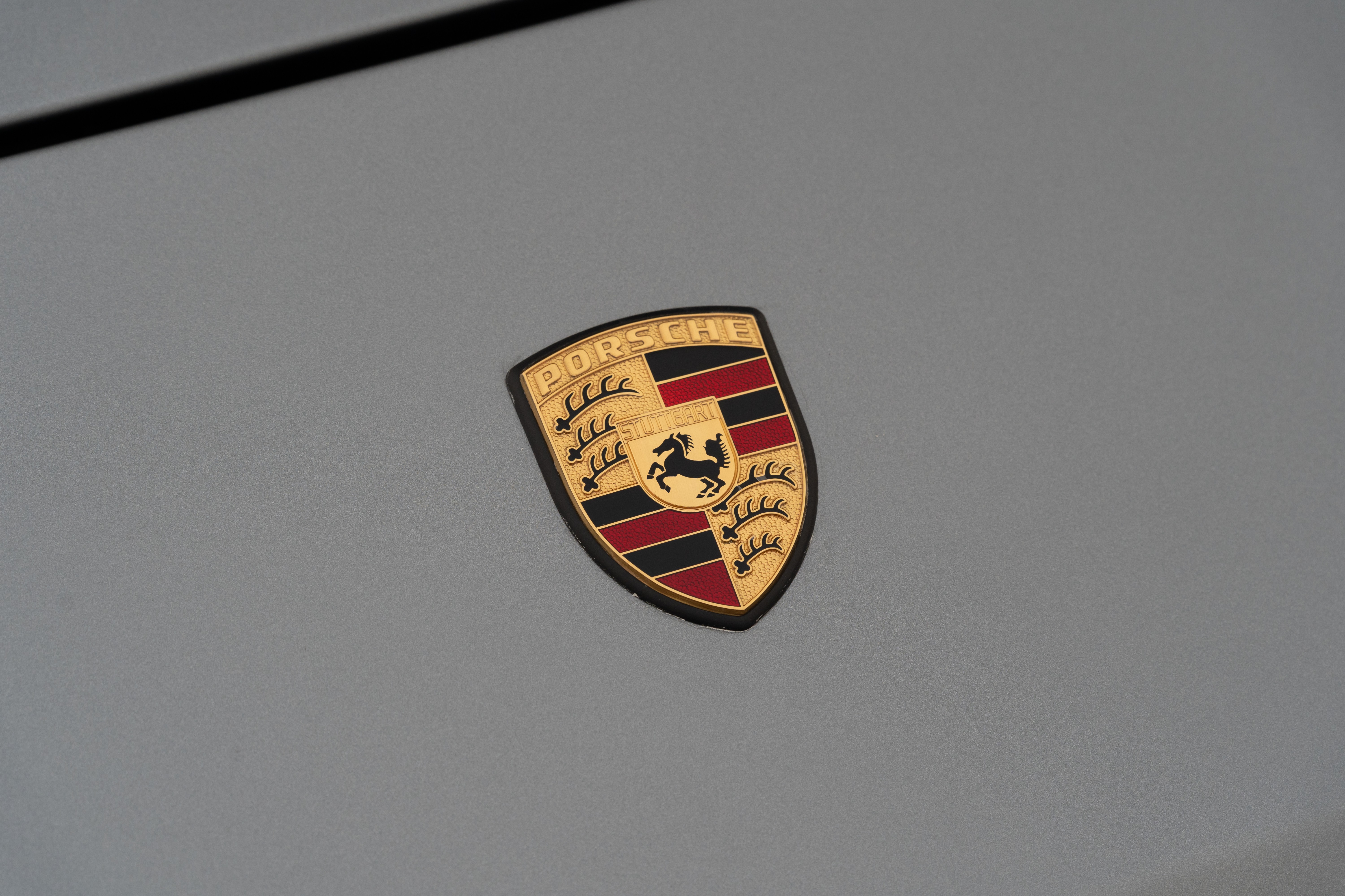 Badge on a Titanium Metallic 1990 Porsche 944 S2 Cabriolet 5-Speed shot in Austin, TX.