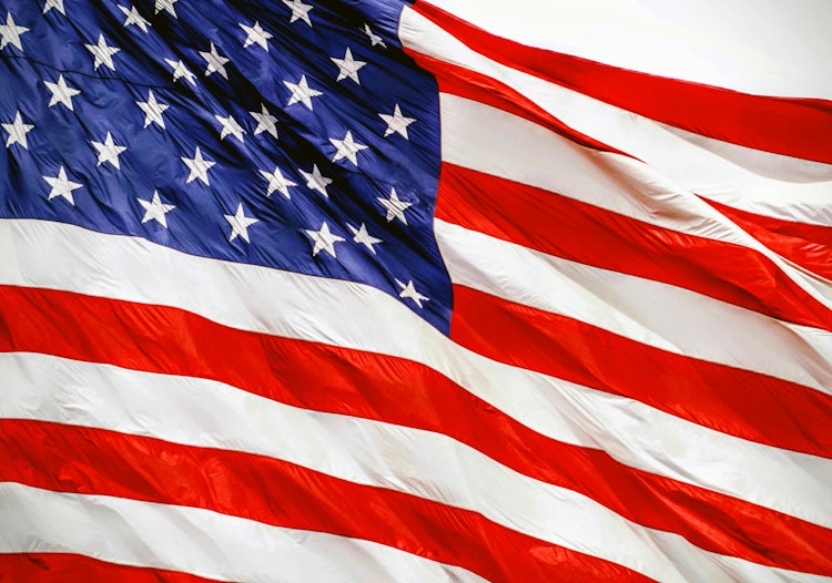 American flag representing the expansion of Polymarket access in the United States.