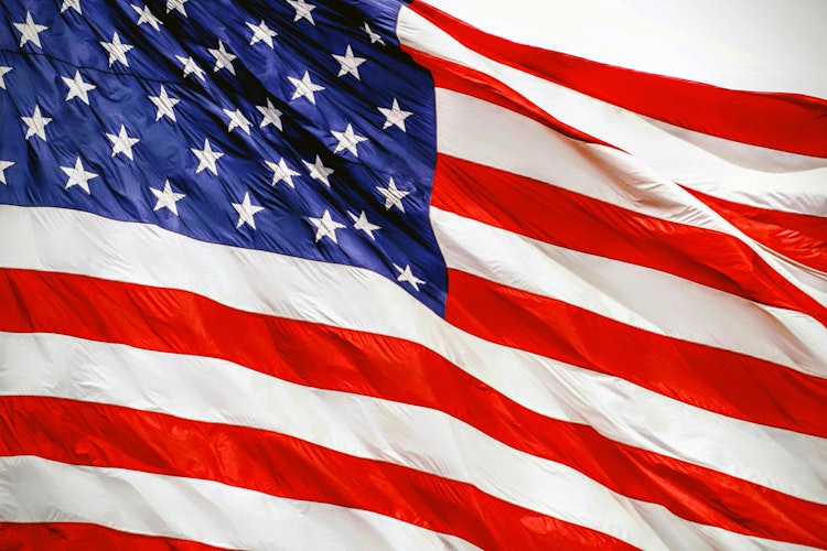 American flag representing the expansion of Polymarket access in the United States.