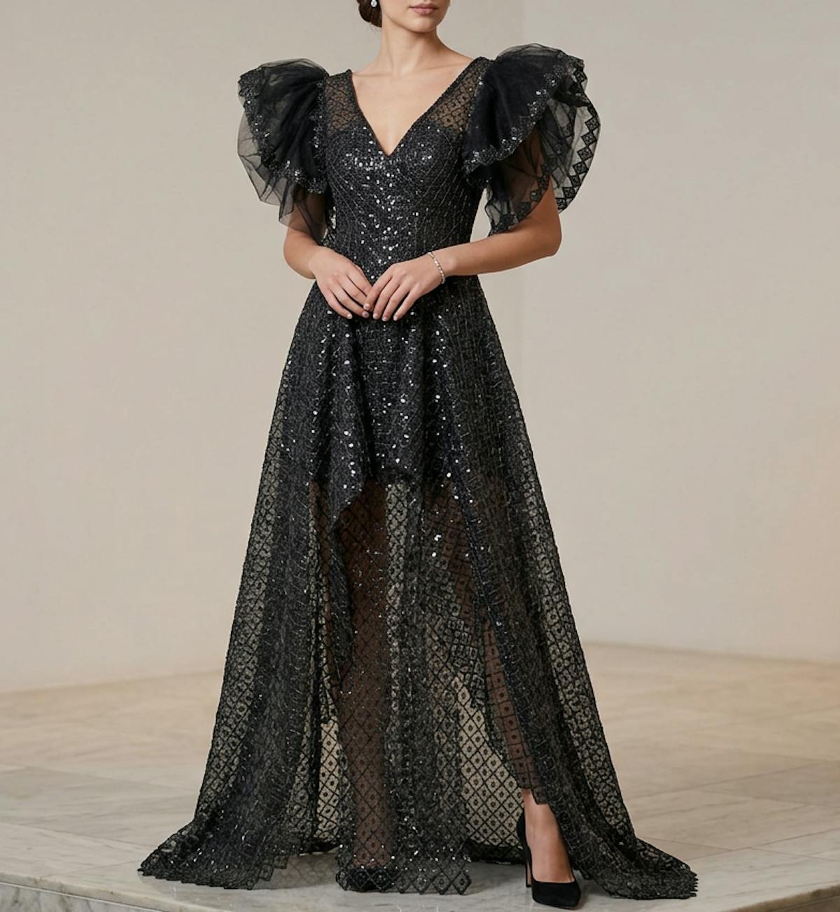 Black Metallic tulle gown with puff sleeves and front skirt slits as worn to the Grammys by Becca Brazil