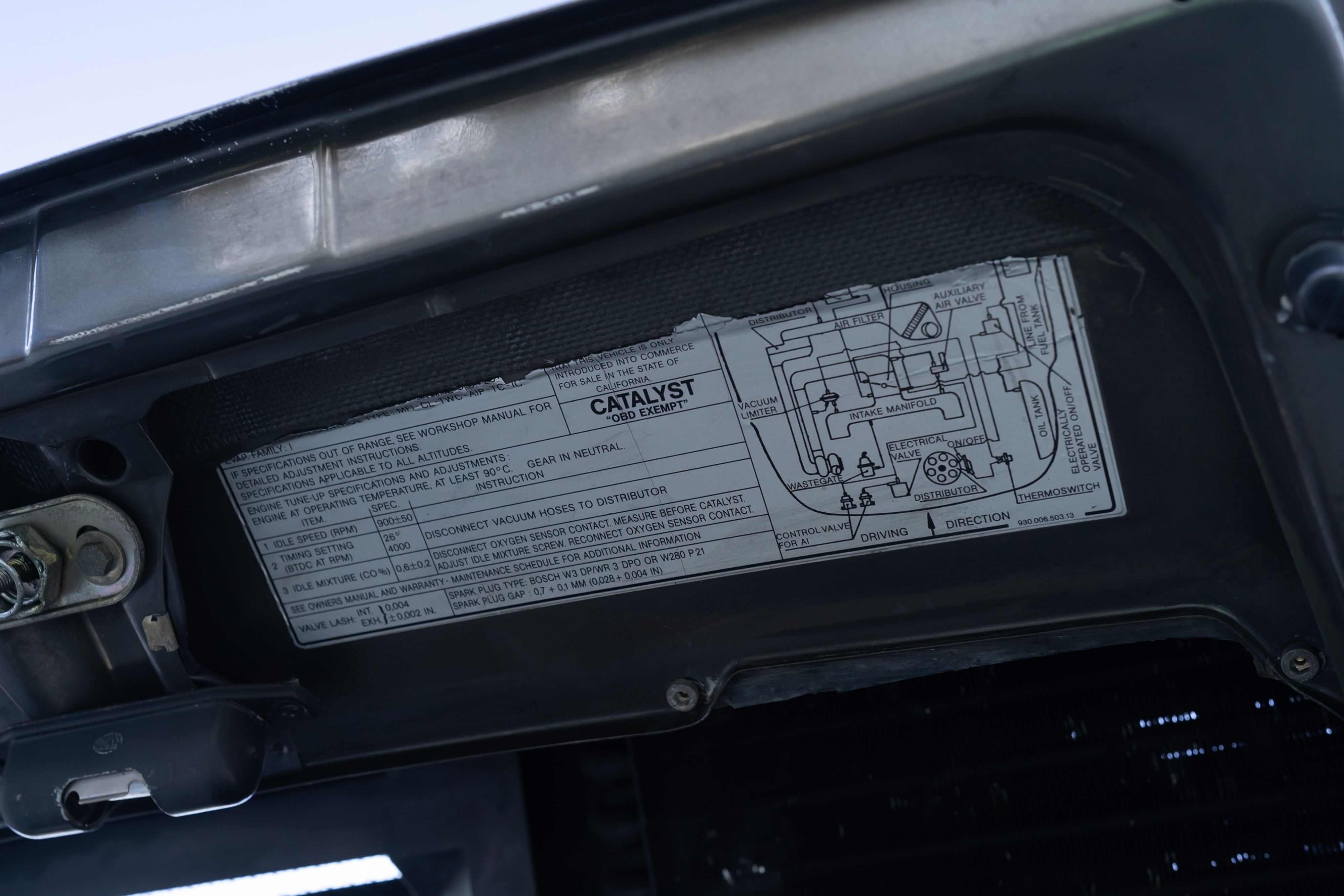 Emissions tag on a 1989 Porsche 911 Turbo M505 Slant Nose.