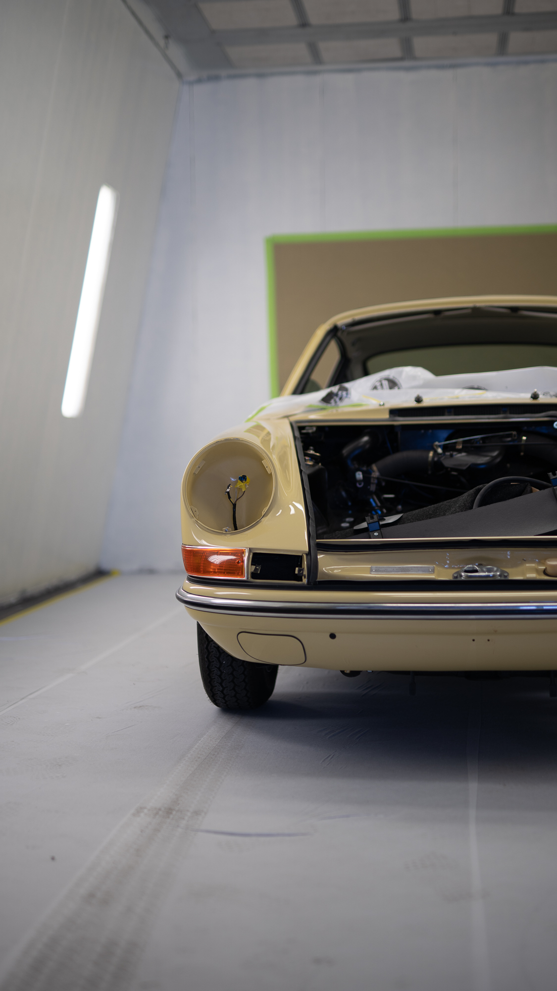 Champagne Yellow early 911 in the paint booth