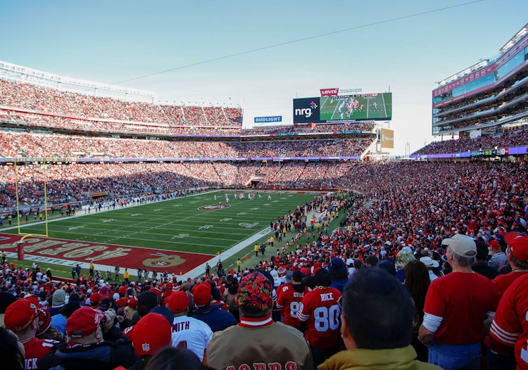 Fans at Levi's Stadium watch an NFL game.