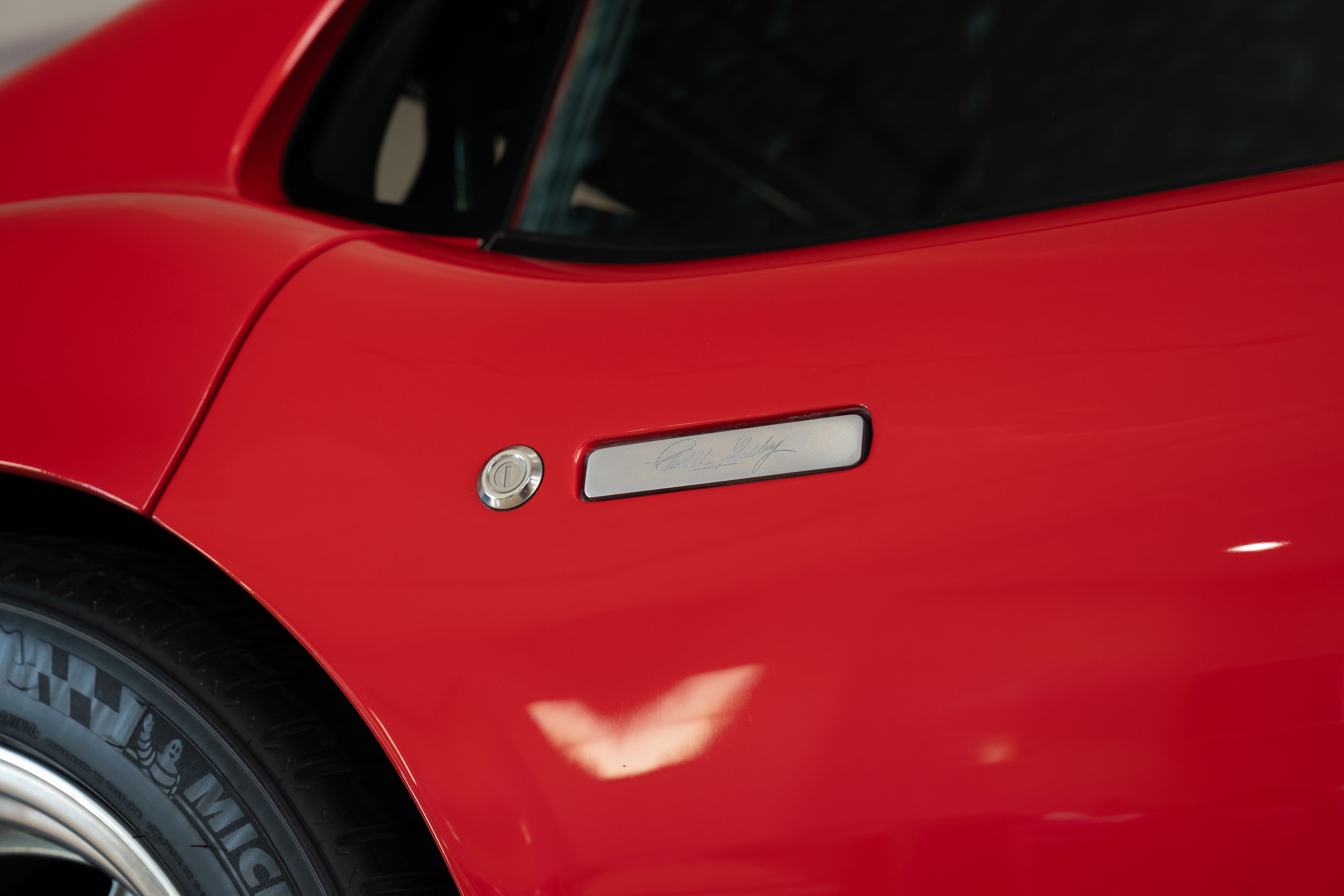 Shelby door handle on a 1965 Superformance Shelby Daytona CSX9114 in Monza Red.