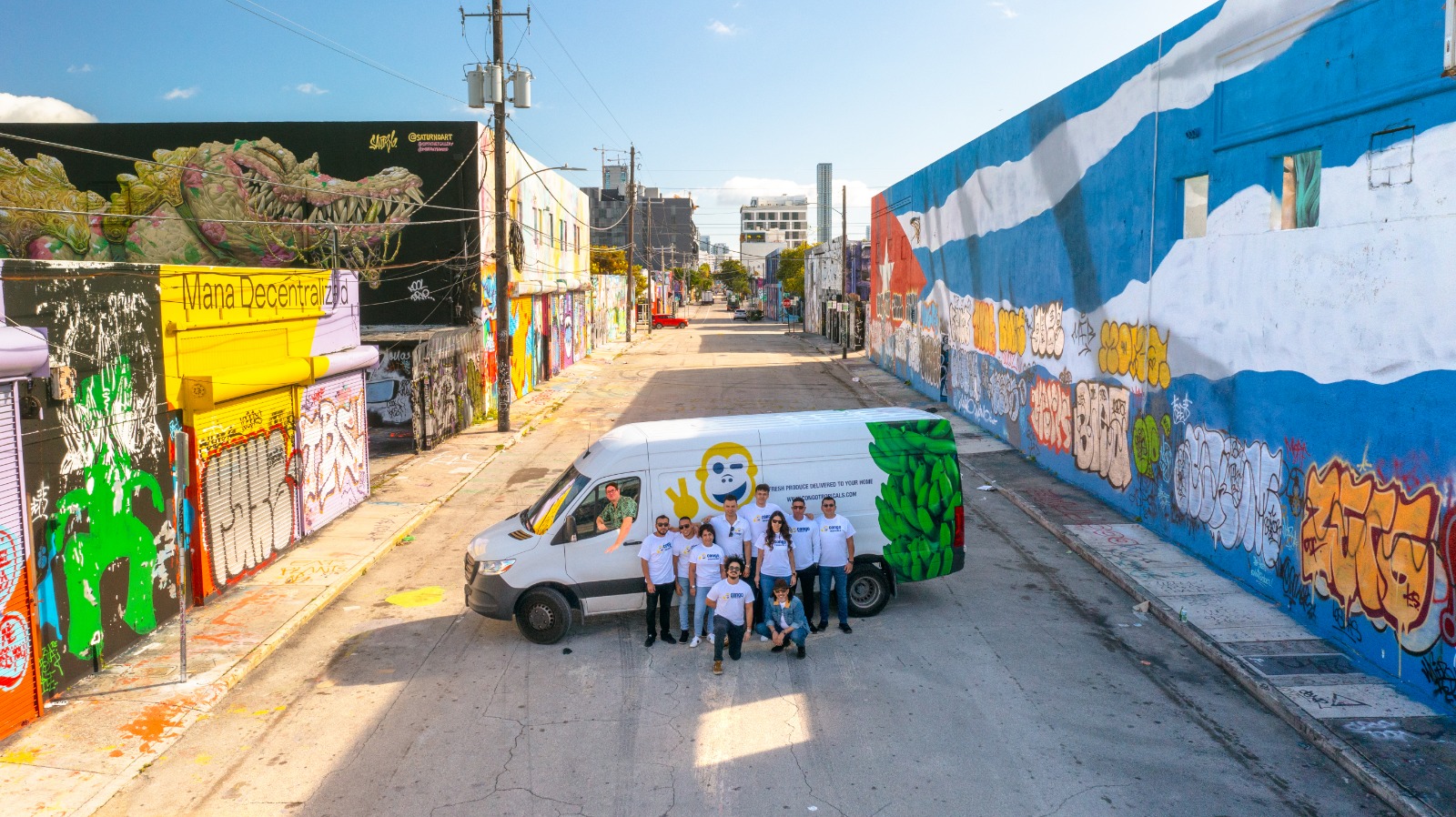 Image of a product truck in an alley with graffiti