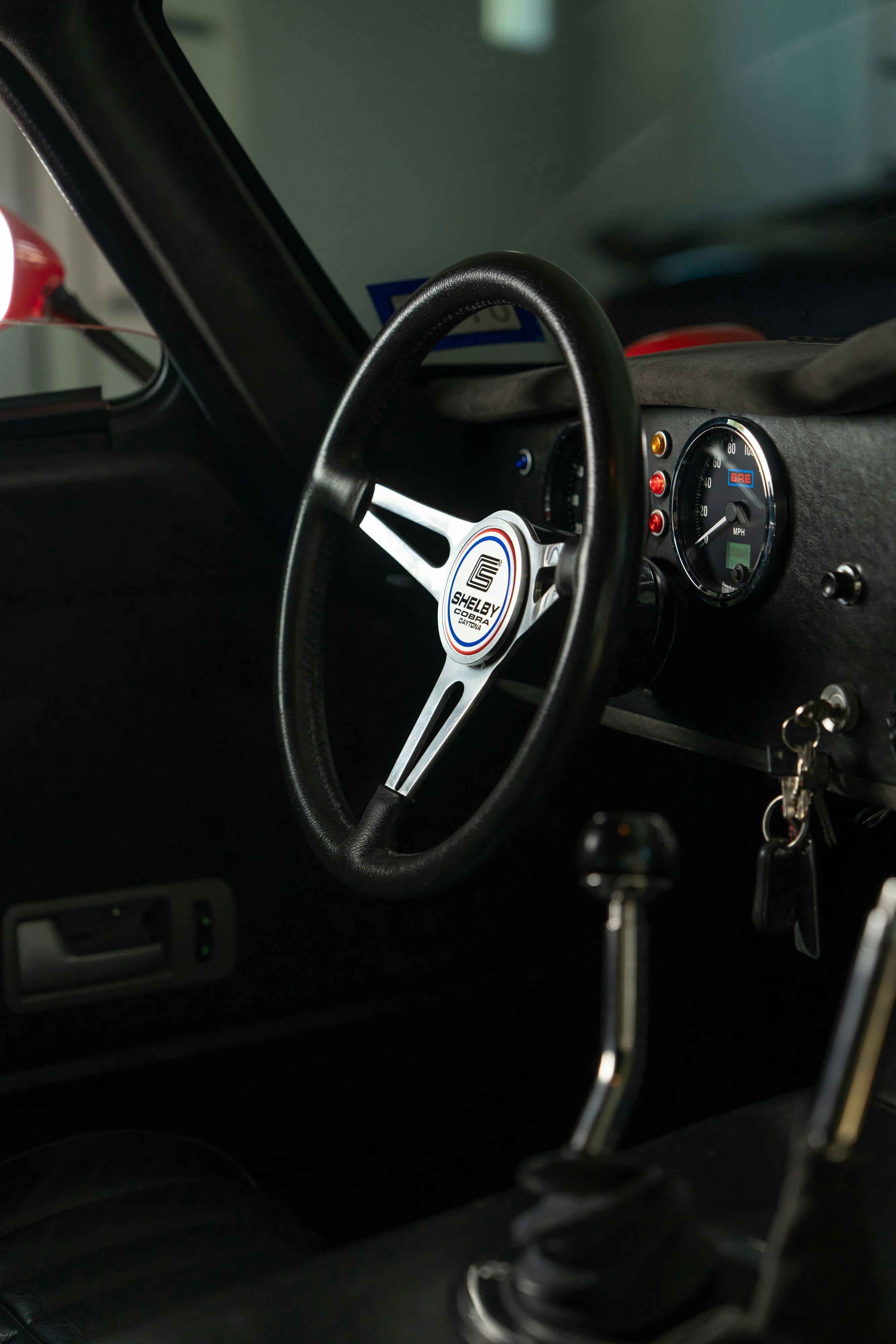Interior of a 1965 Superformance Shelby Daytona CSX9000 in Monza Red.