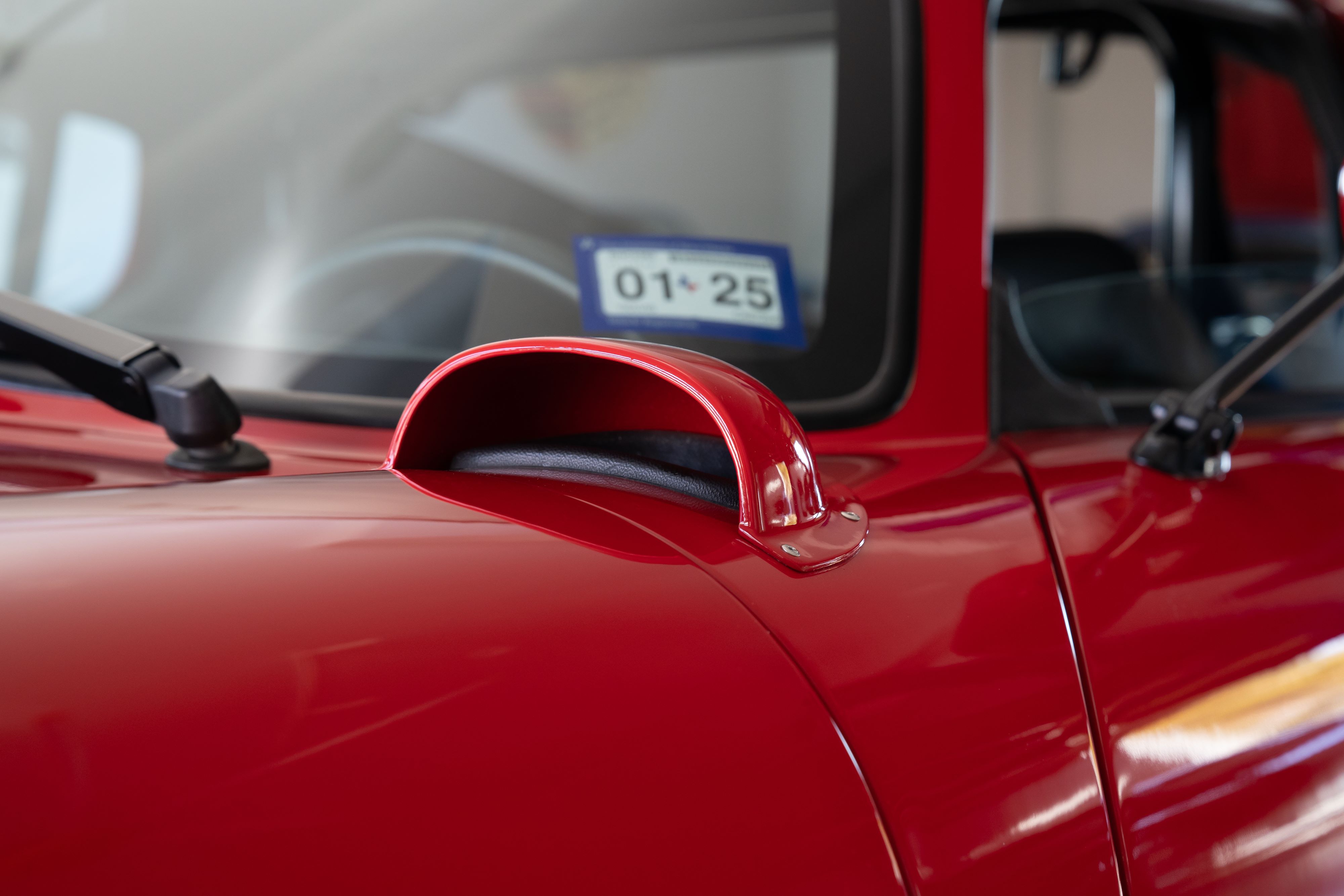 Fender air scoop on a 1965 Superformance Shelby Daytona CSX9000 in Monza Red.