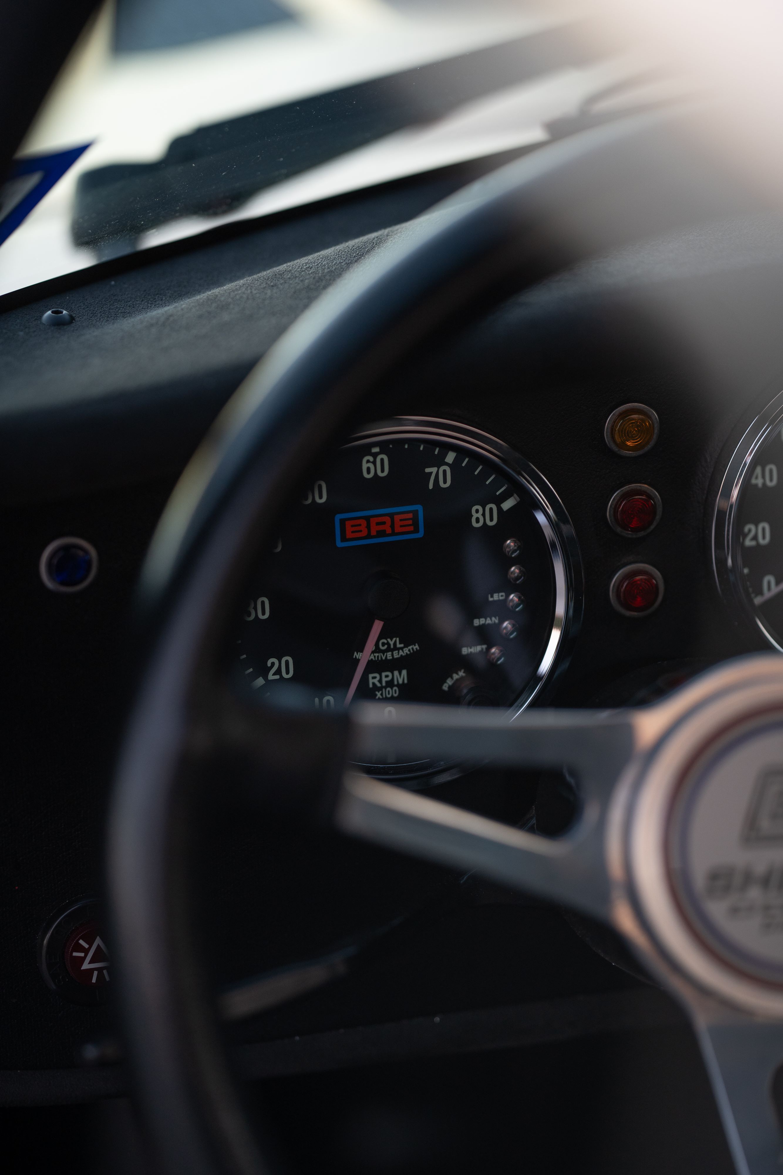 Digital gauges on a 1965 Superformance Shelby Daytona CSX9114 in Monza Red.