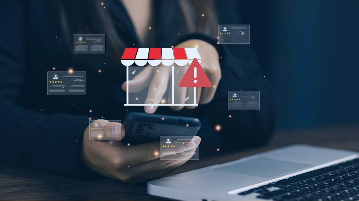 Online marketplace storefront with warning sign and review cards, representing online scam risks for buyers and sellers