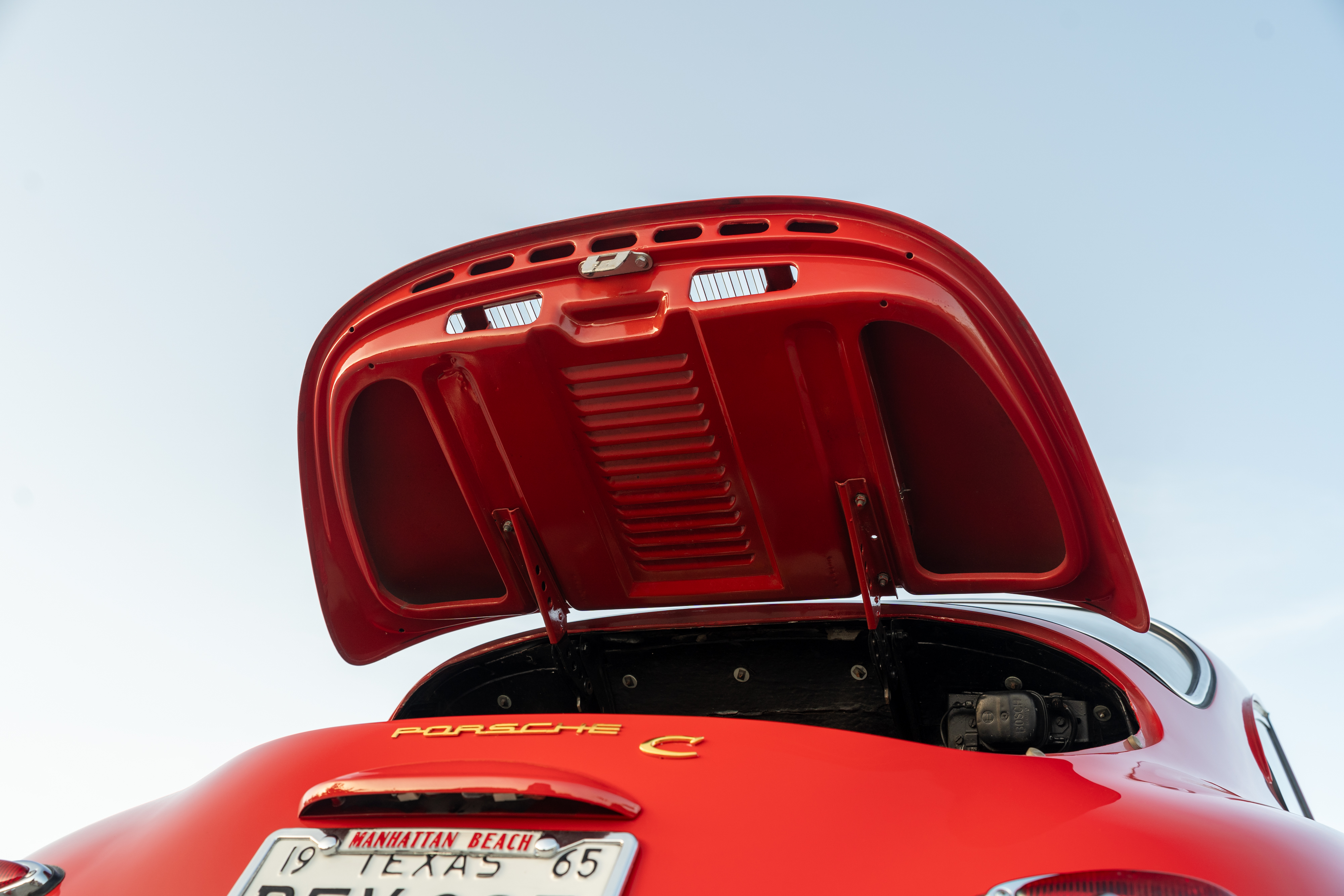 Red on Black trunk lid of a 1965 Porsche 356C Coupe shot in Austin, TX.