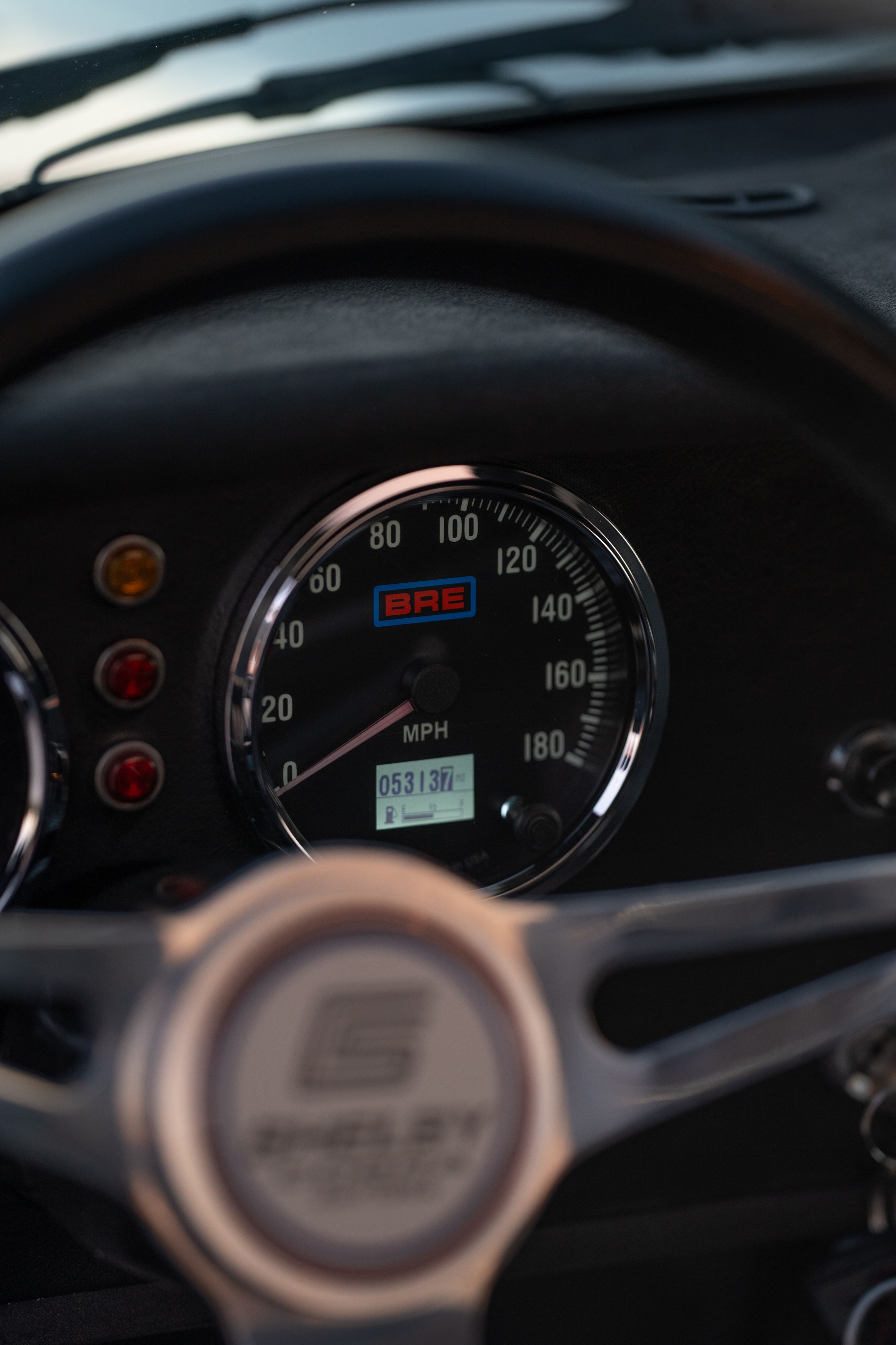 Digital gauges on a 1965 Superformance Shelby Daytona CSX9114 in Monza Red.