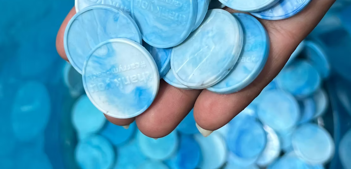Souvenir-coins-made-from-recycled-plastic-in-the-Everest-region---Copyright-Carry-Me-Back.png