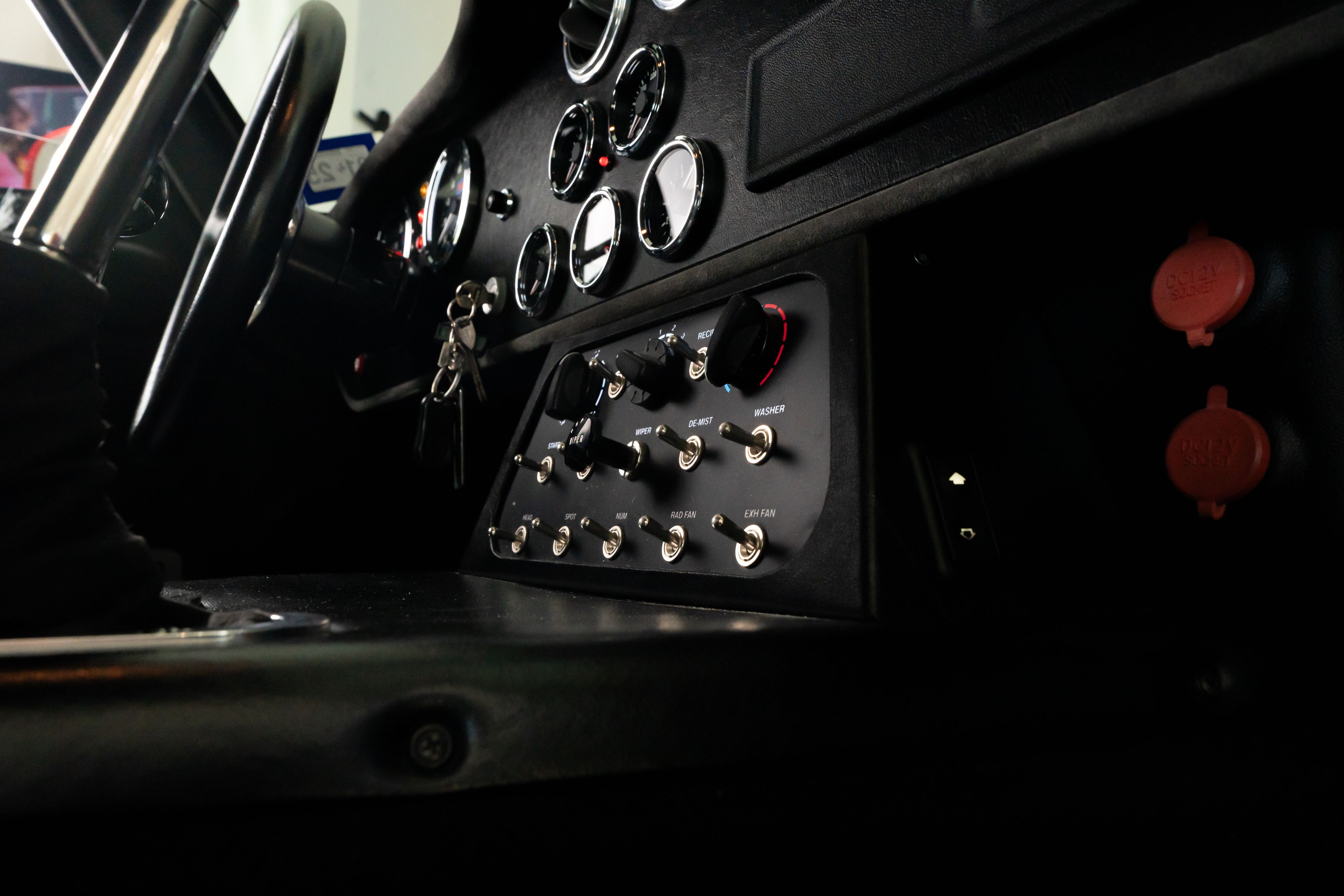 Interior of a 1965 Superformance Shelby Daytona CSX9000 in Monza Red.