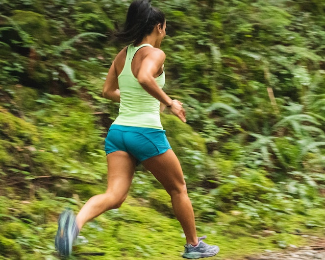 Woman running on an outdoor trail