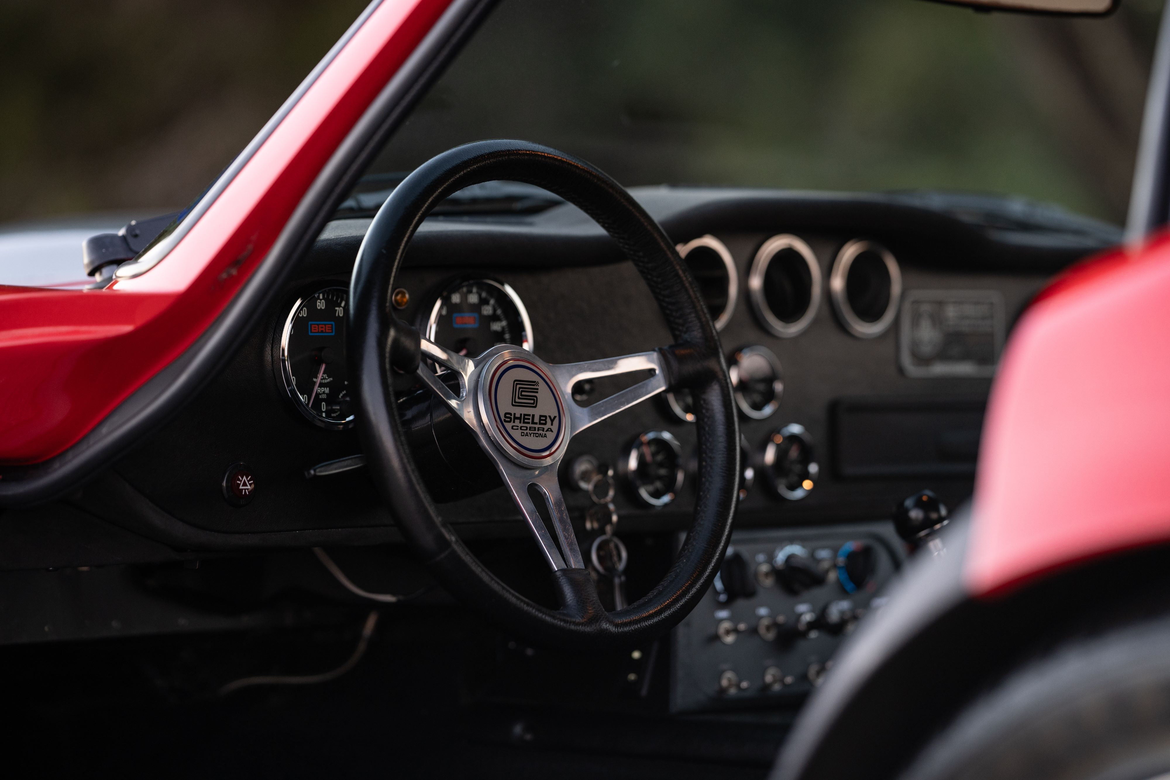 1965 Superformance Shelby Daytona CSX9114 steering wheel in Monza Red.