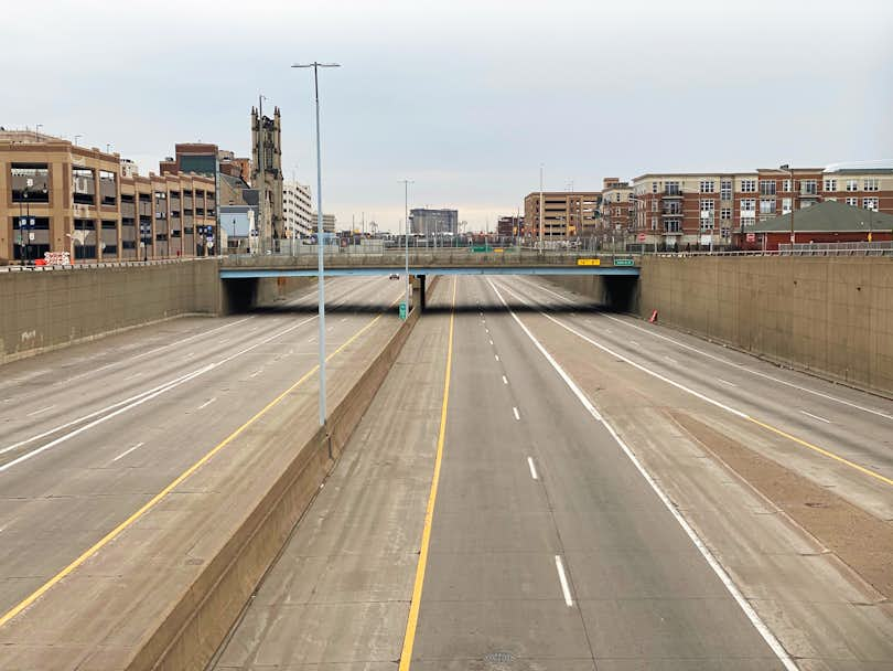 Image of empty road and underpass suggesting a vacant city