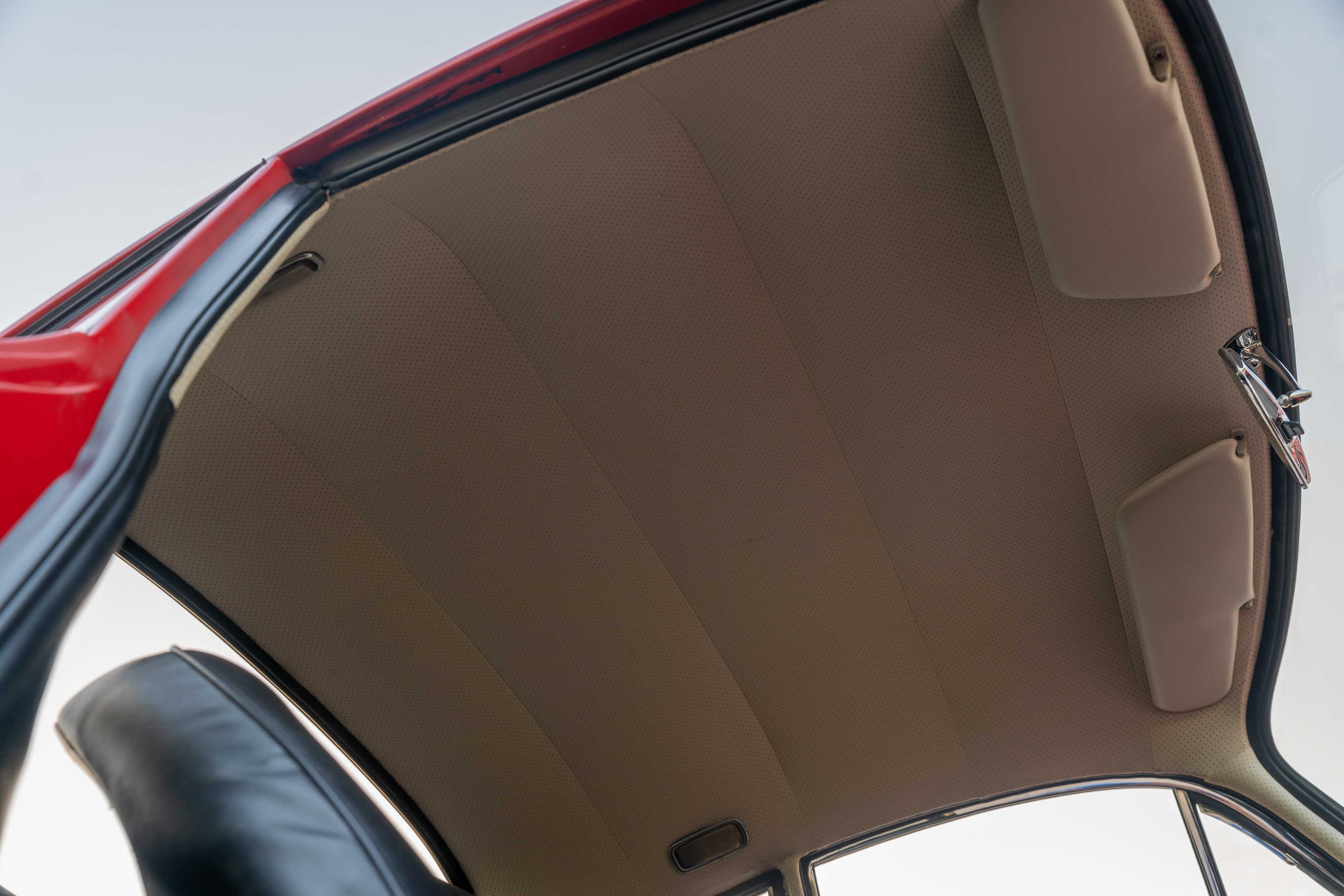 Red on Black headliner of a 1965 Porsche 356C Coupe shot in Austin, TX.