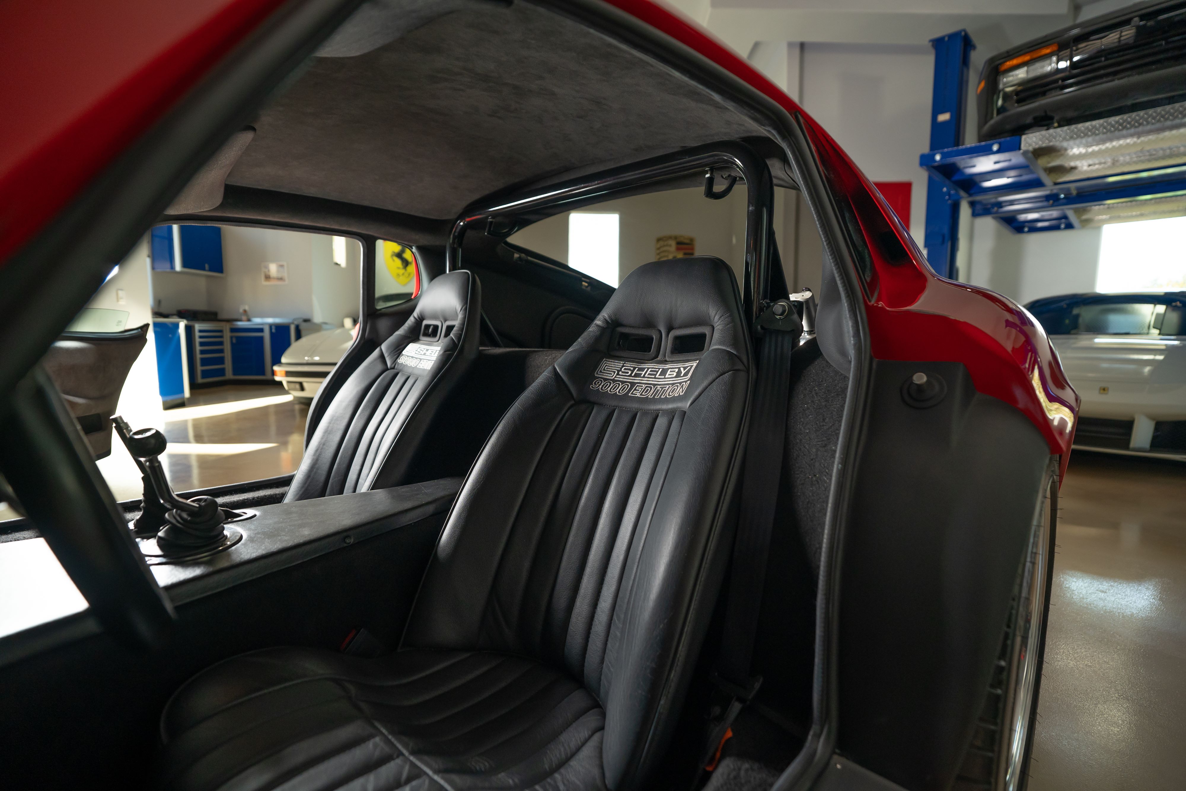 Seats in a 1965 Superformance Shelby Daytona CSX9000 in Monza Red.