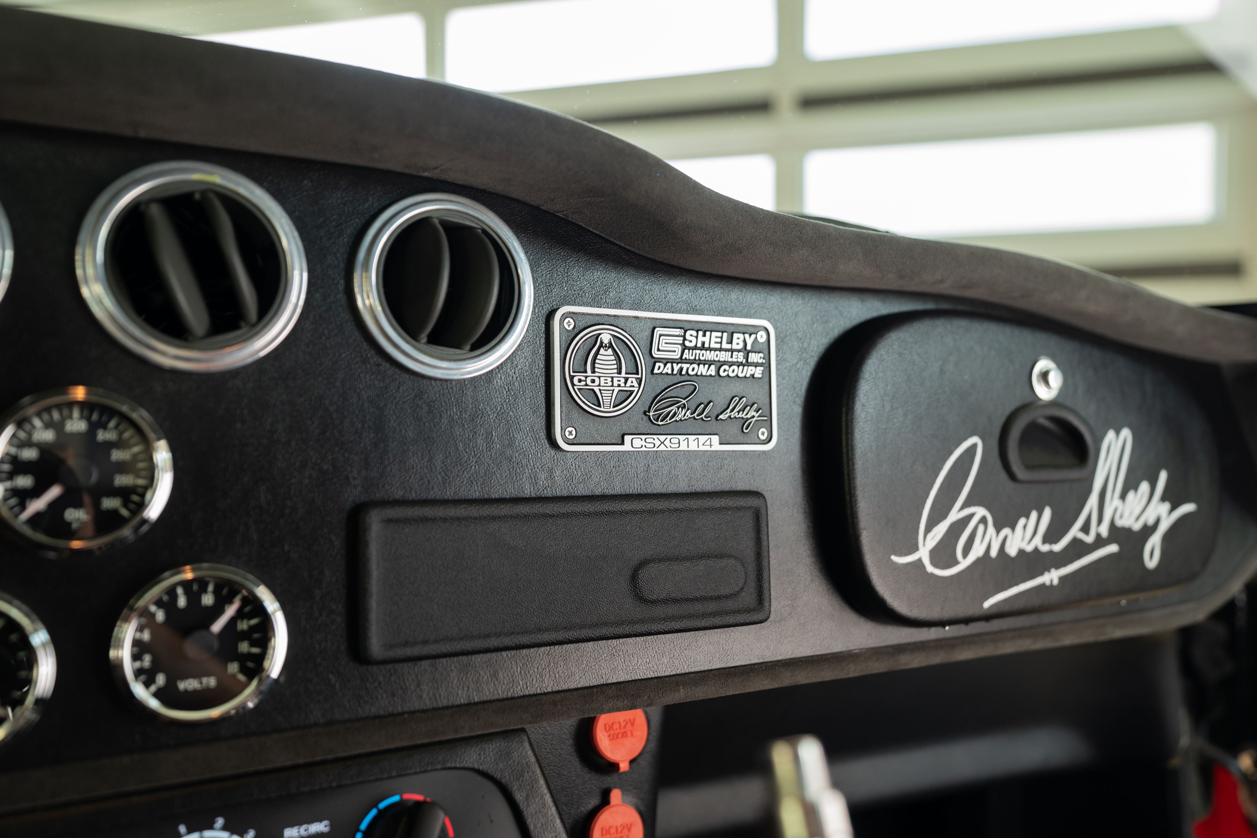 Interior of a 1965 Superformance Shelby Daytona CSX9000 in Monza Red.