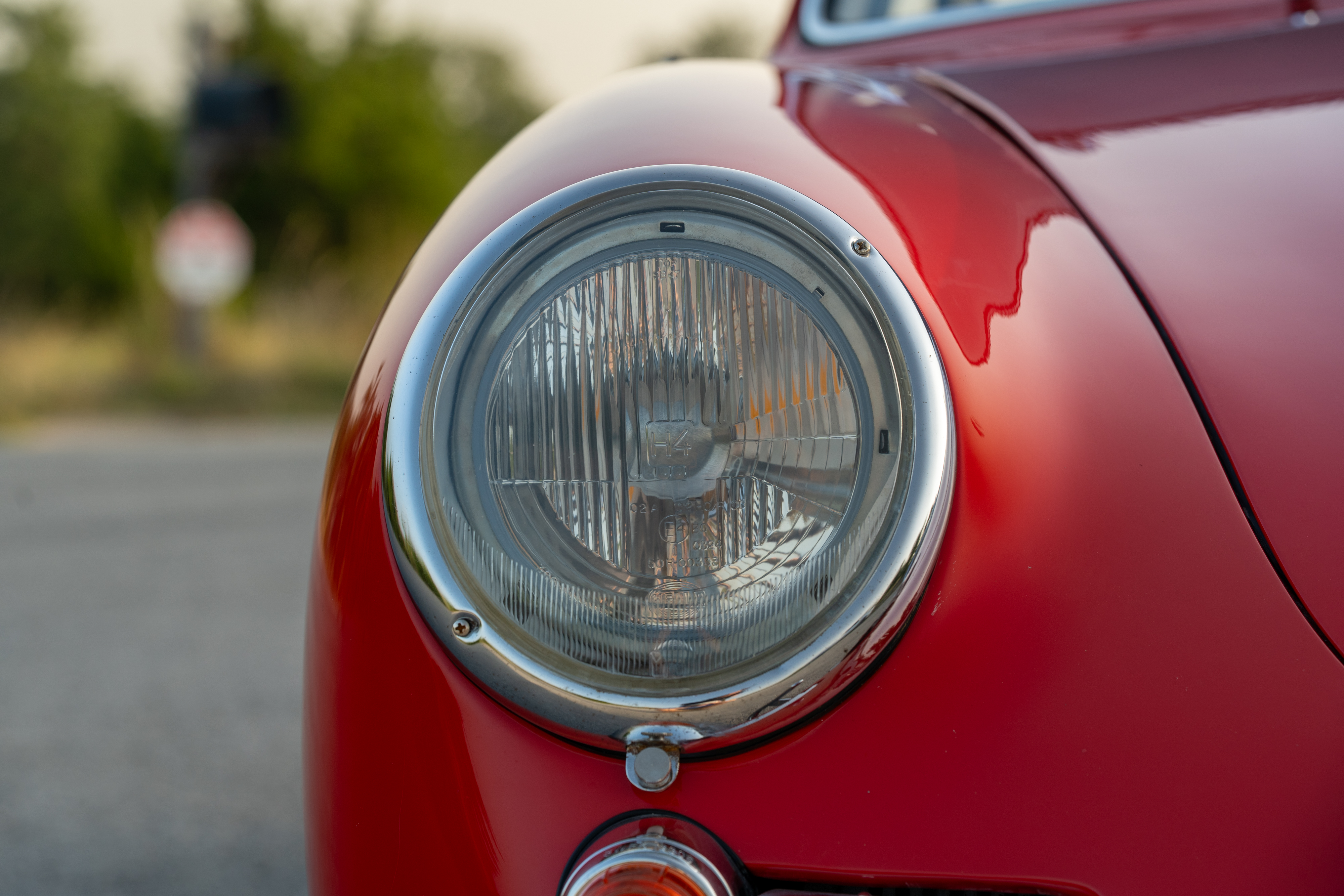 H4 headlight of a 1965 Porsche 356C Coupe shot in Austin, TX.