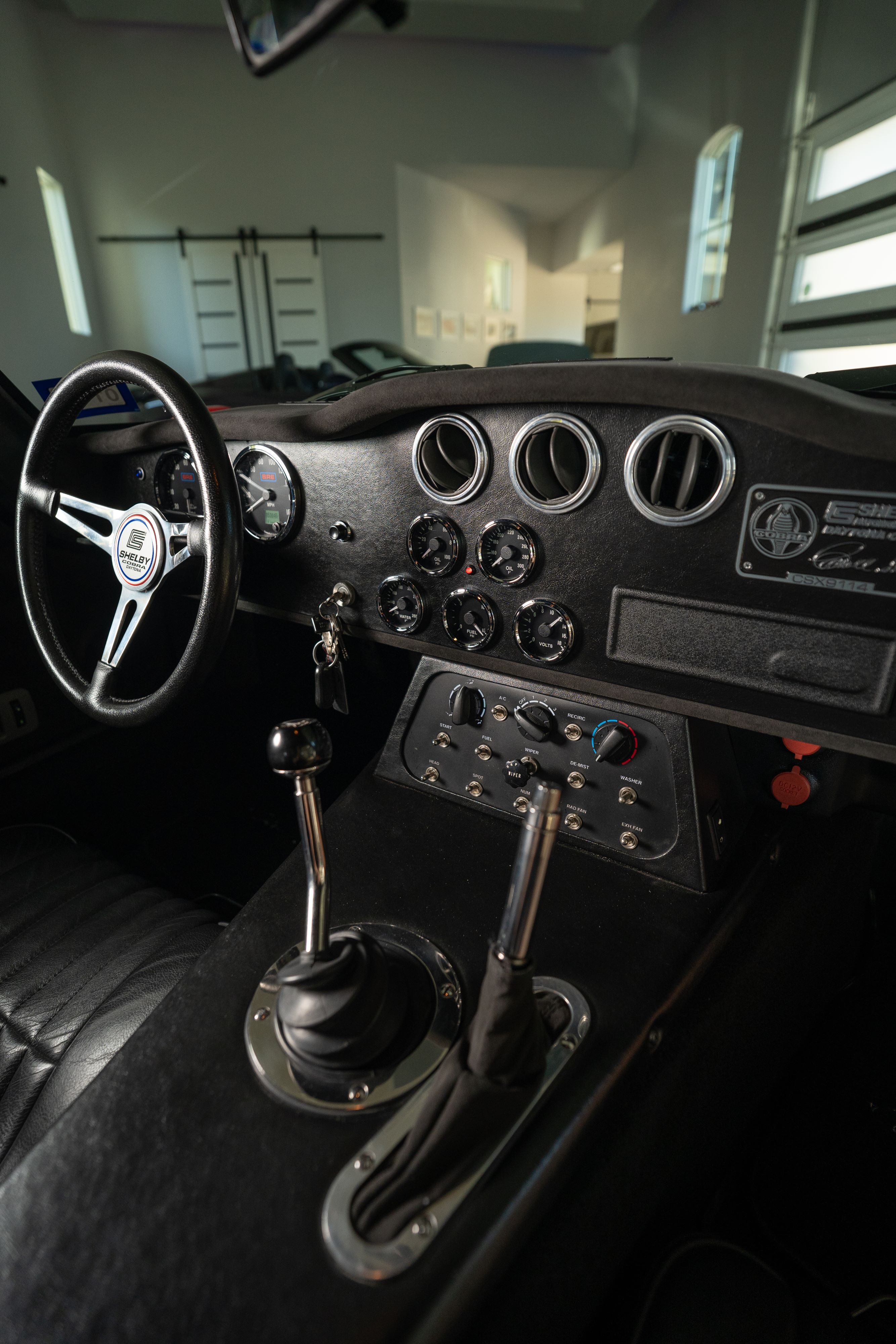 Interior of a 1965 Superformance Shelby Daytona CSX9000 in Monza Red.