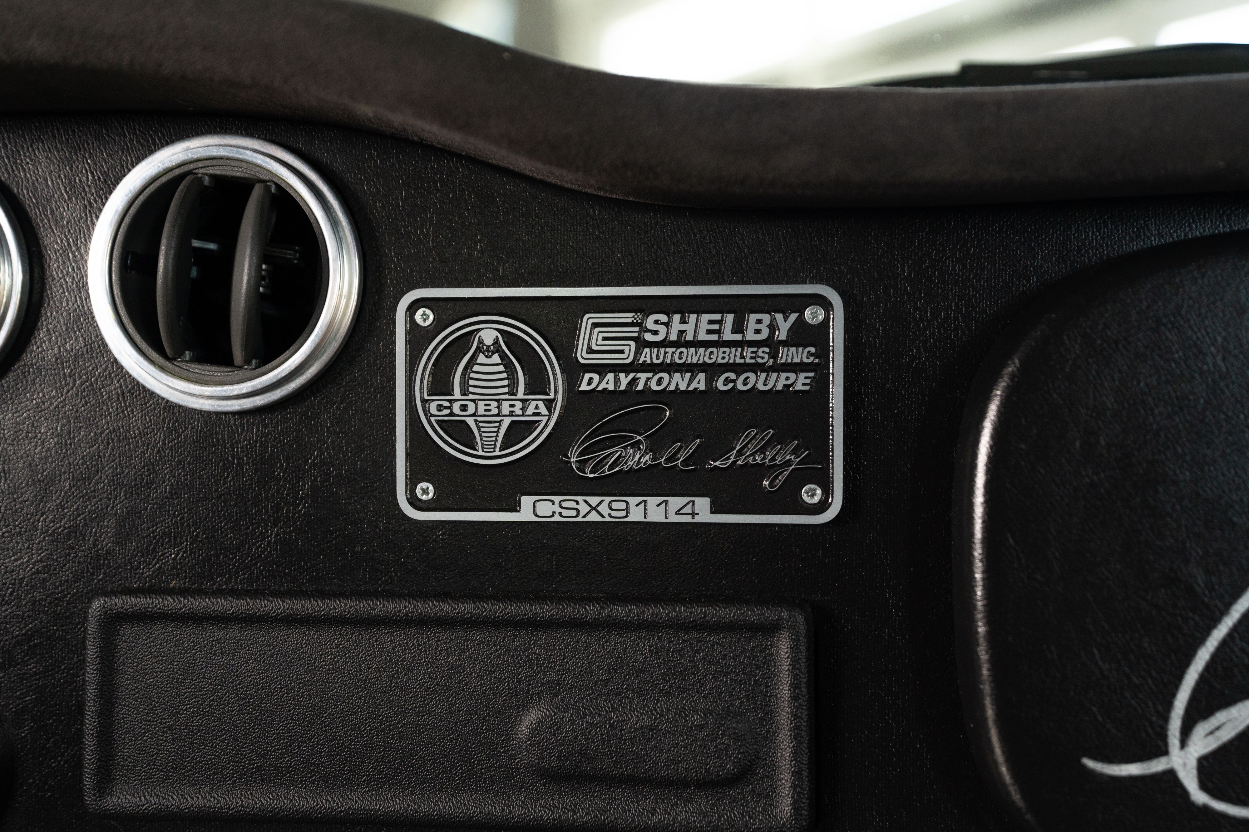 Interior of a 1965 Superformance Shelby Daytona CSX9000 in Monza Red.