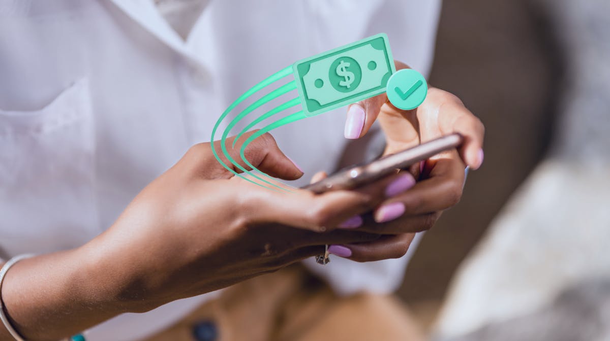 Woman using a smartphone to send a Venmo payment, illustrating the benefits and risks of Venmo purchase protection.