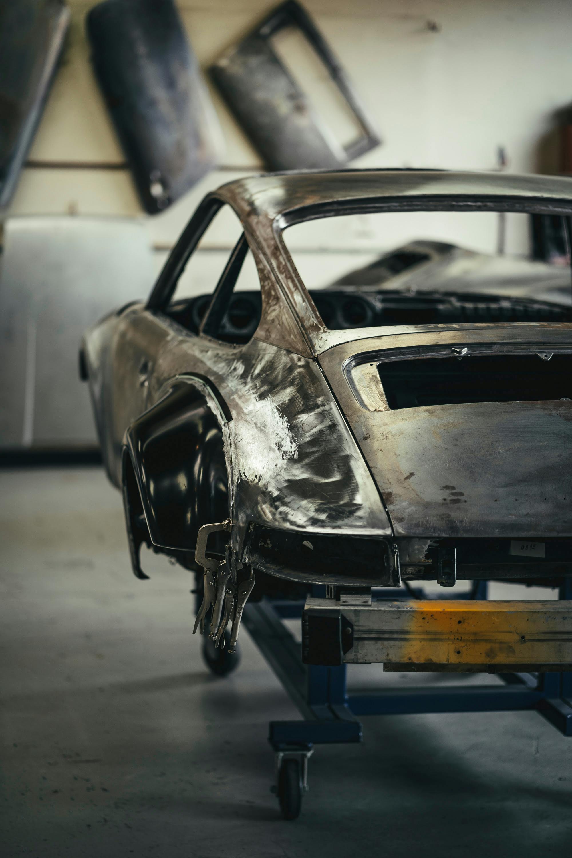 Cars awaiting restoration in the metal shop at CPR.