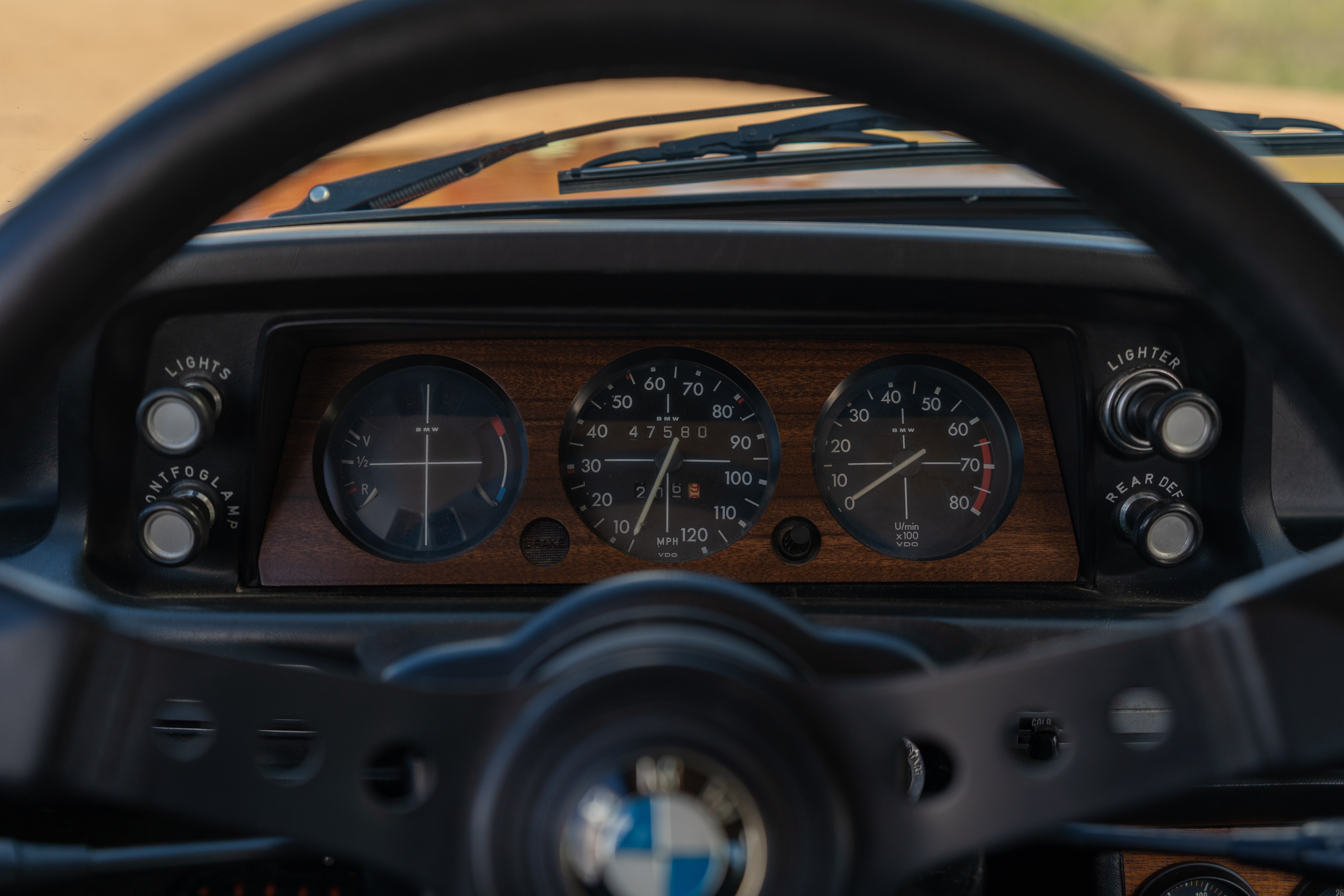 Gauge cluster on an Orange 1976 BMW 2002 2.2L 5-Speed shot in Blanco, TX.