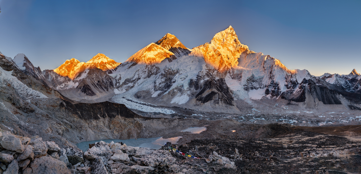 A-panoramic-shot-of-the-Khumbu-glacier-with-a-clear-blue-sky---The-Adventure-People.png
