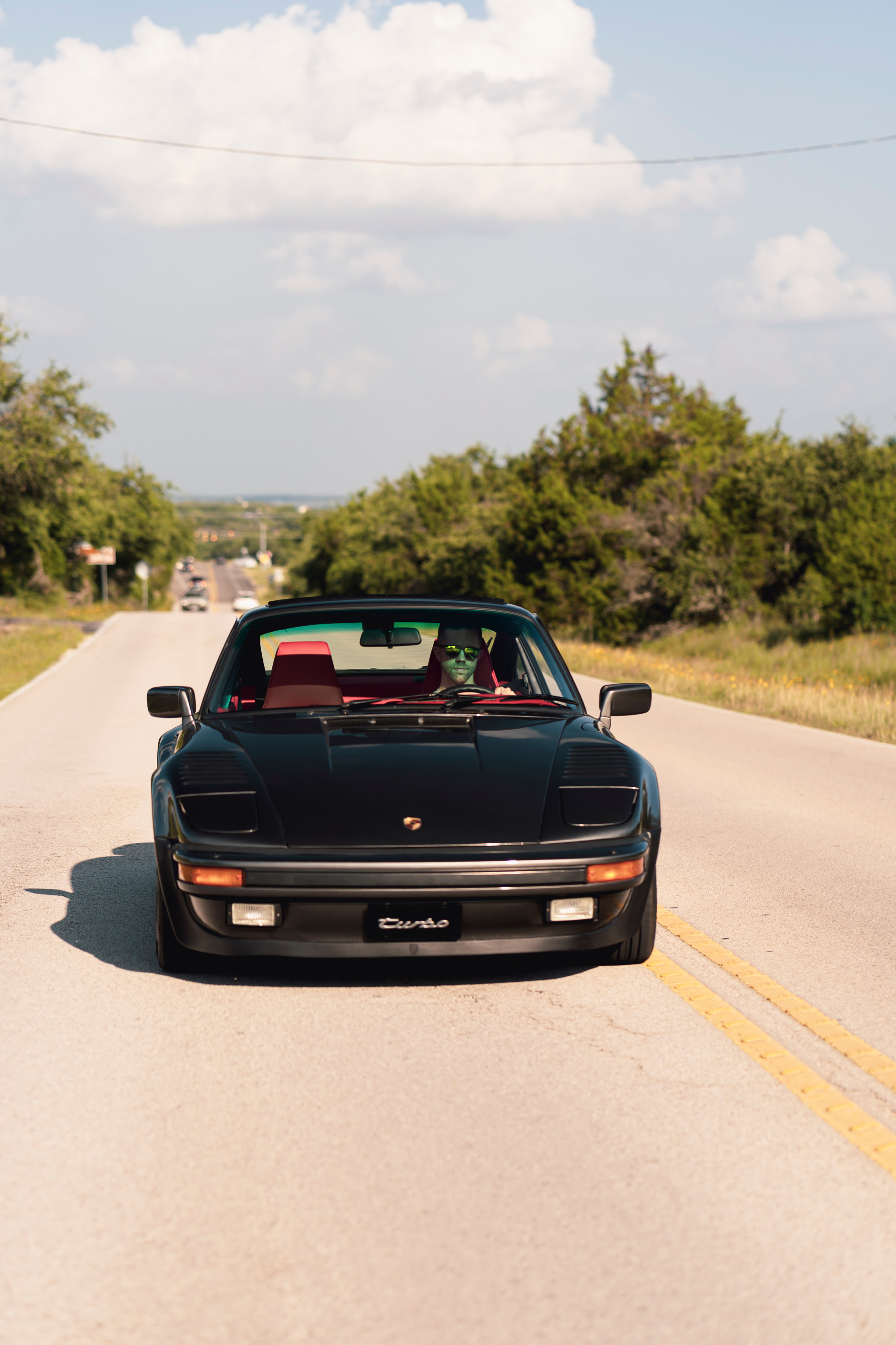 Driving a 930 Slantnose through Dripping Springs, TX.