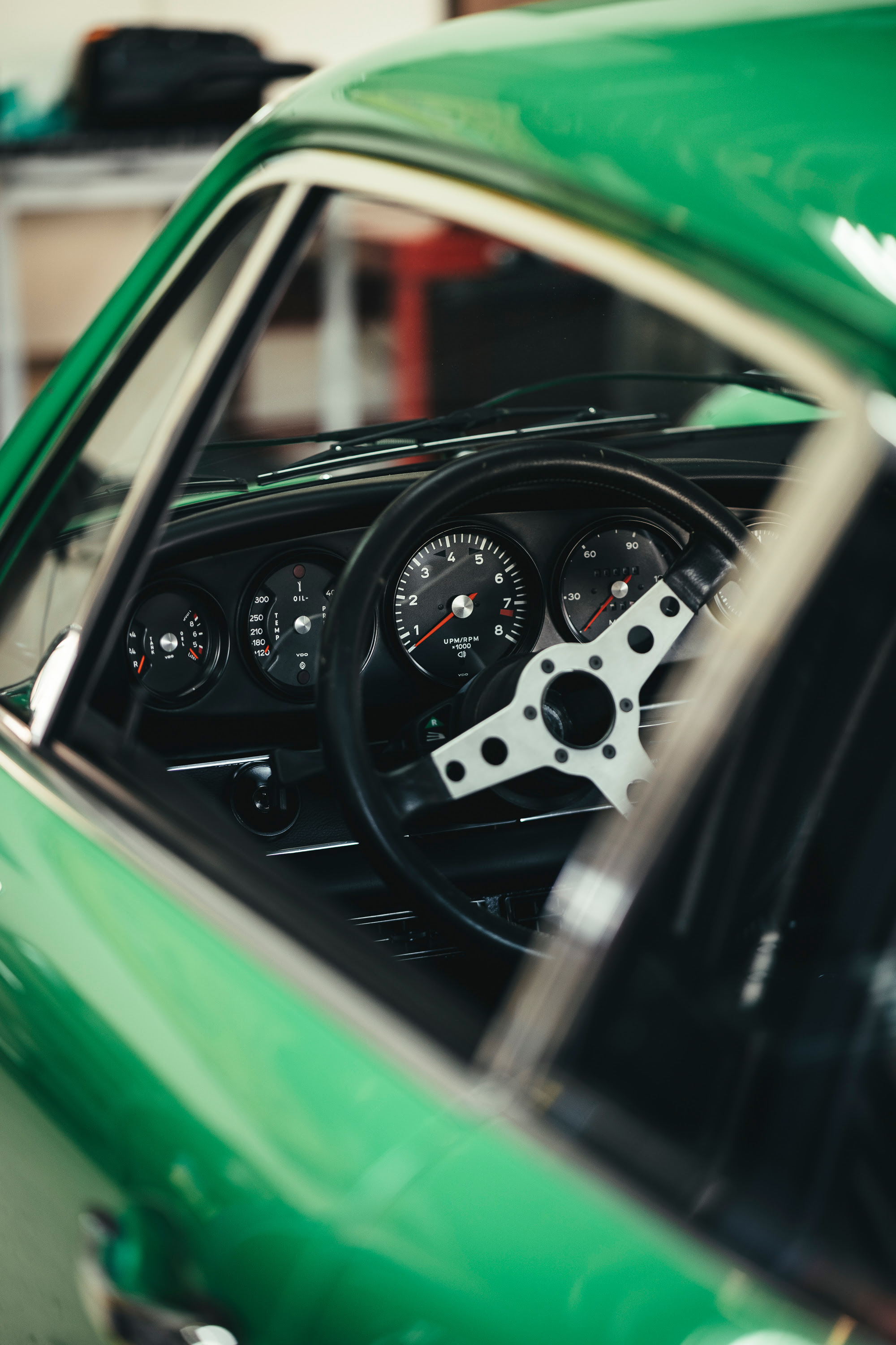 Green 911 dashboard and gauge.