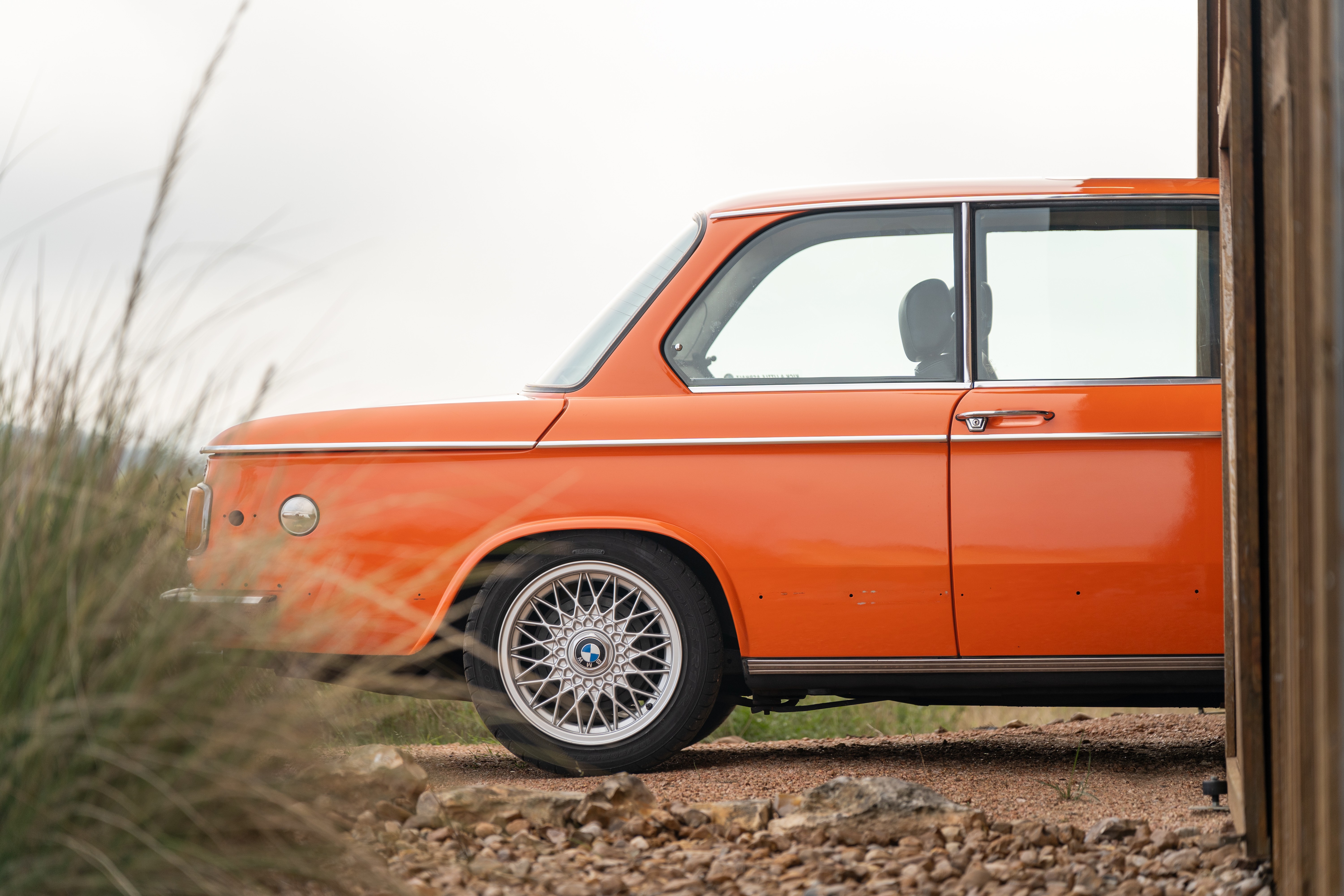 Orange 1976 BMW 2002 2.2L 5-Speed shot in Blanco, TX.