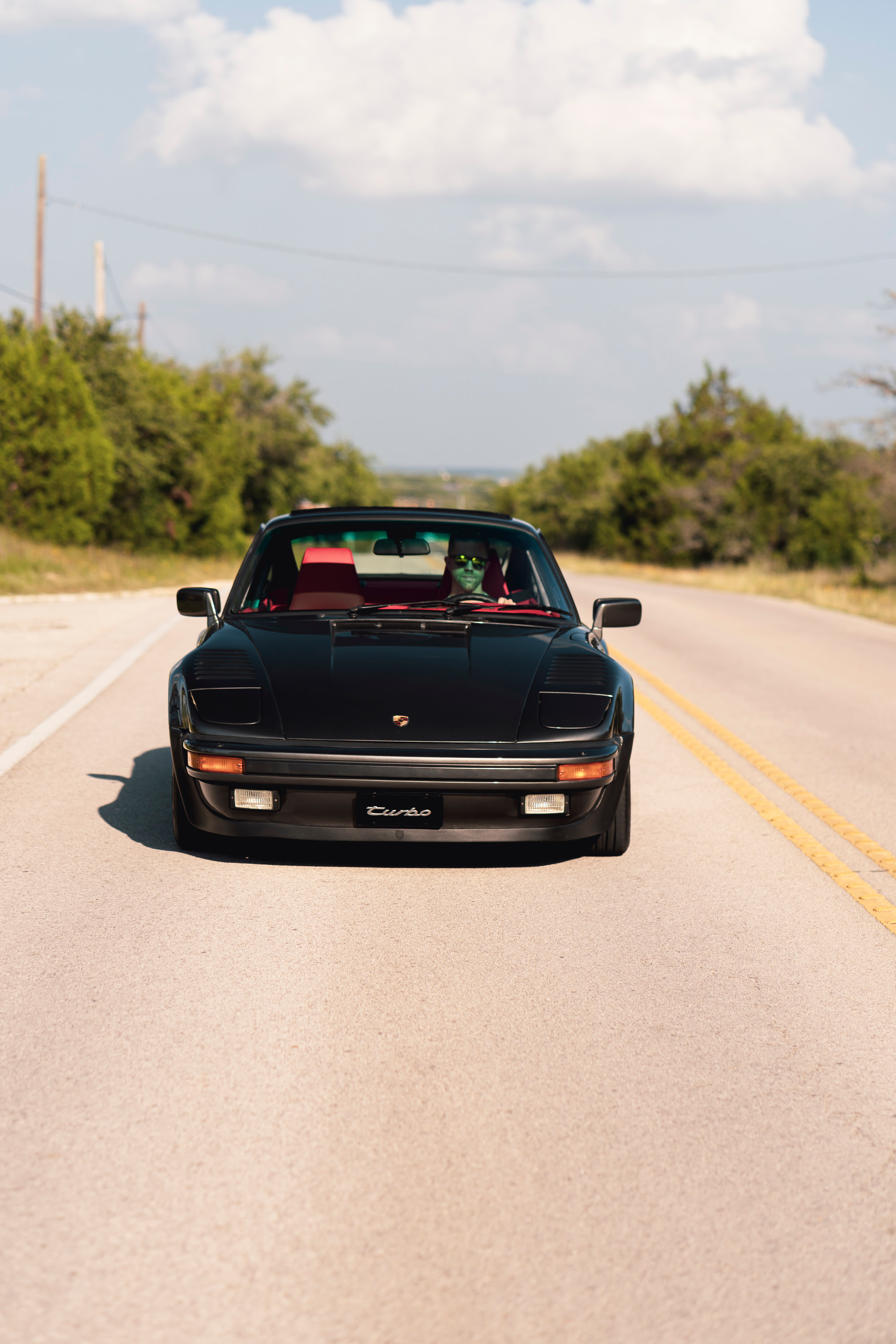 Driving a 930 Slantnose through Dripping Springs, TX.