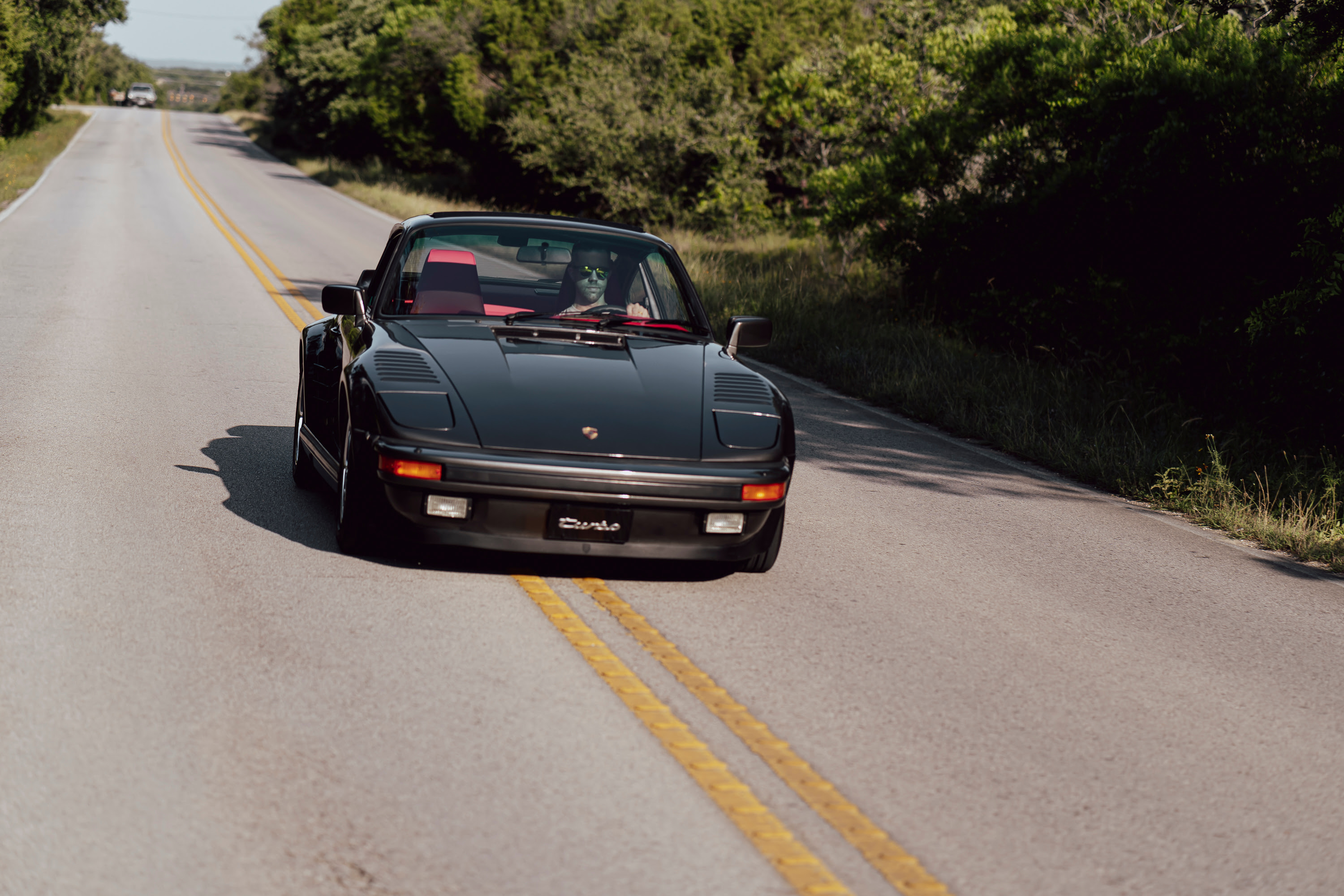 Driving a 930 Slantnose through Dripping Springs, TX.