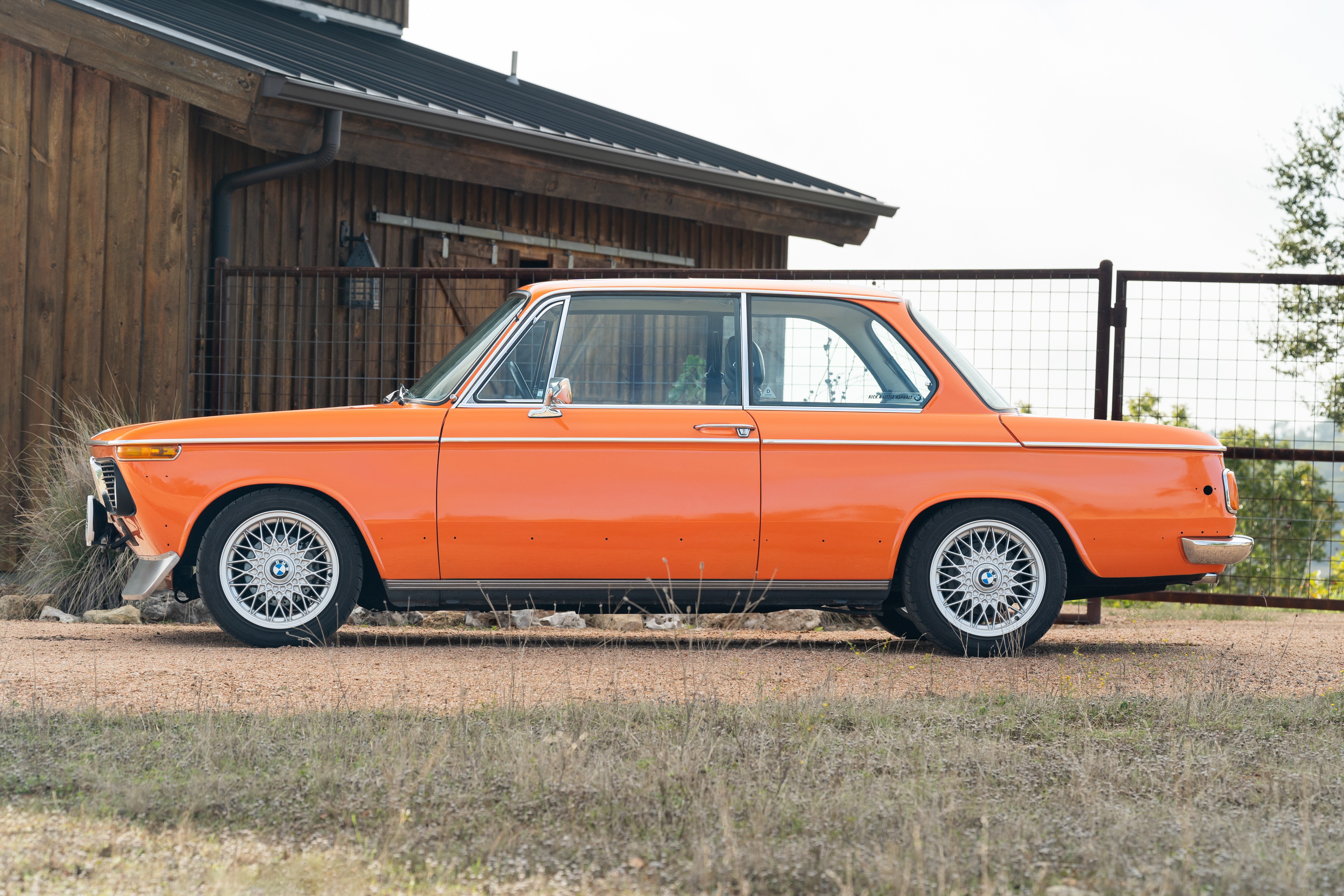 Orange 1976 BMW 2002 2.2L 5-Speed shot in Blanco, TX.