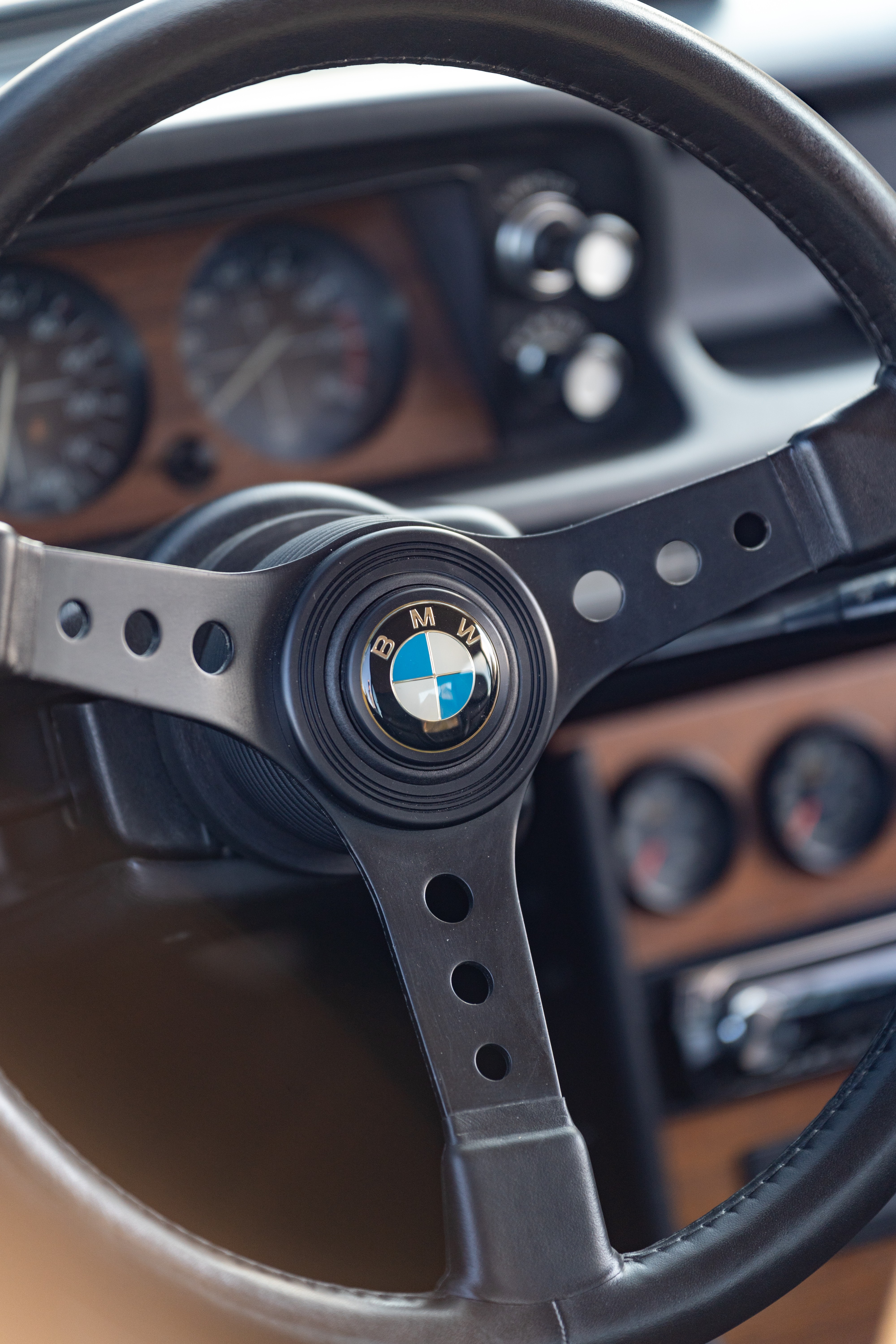 Gauge cluster on an Orange 1976 BMW 2002 2.2L 5-Speed shot in Blanco, TX.