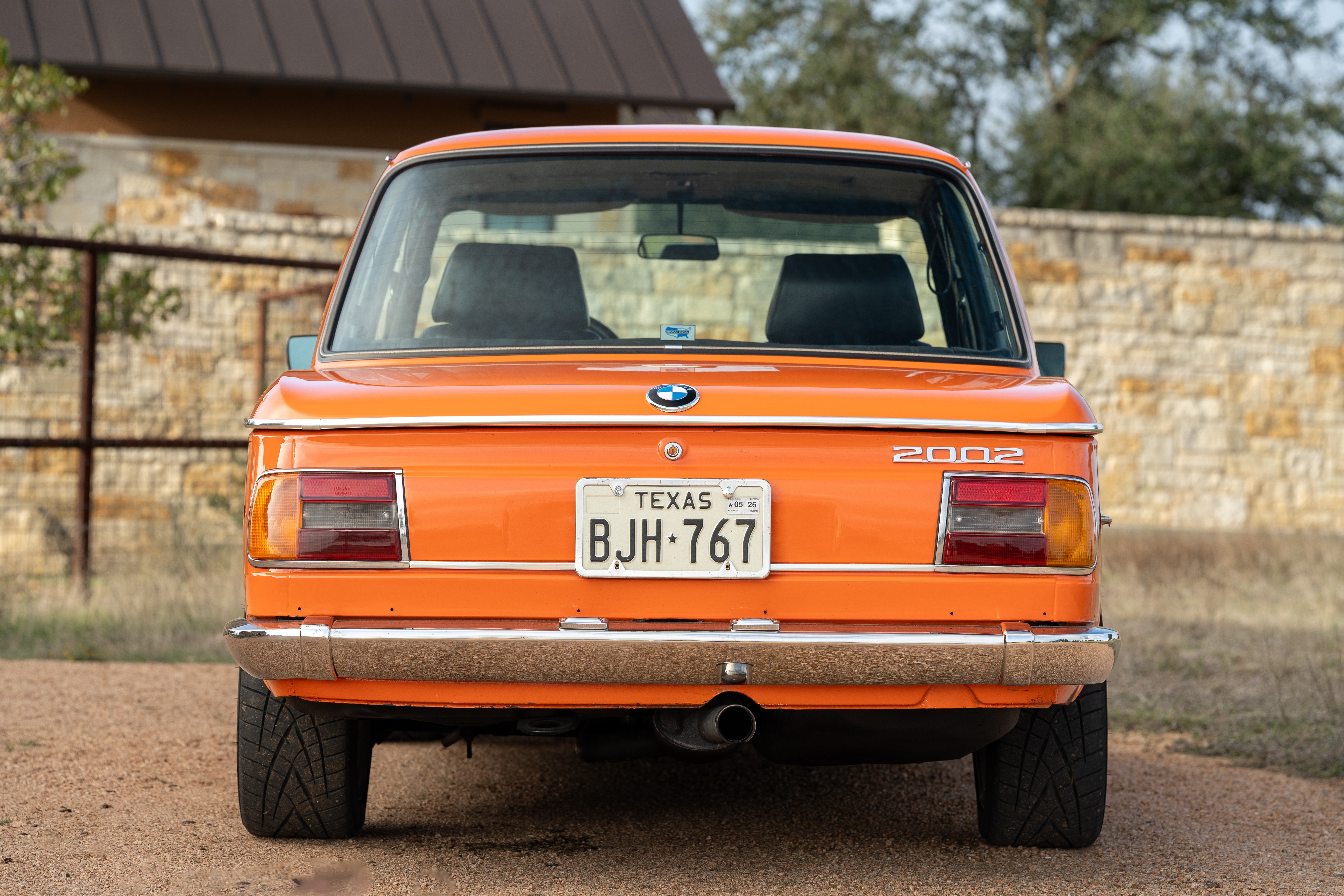 Orange 1976 BMW 2002 2.2L 5-Speed shot in Blanco, TX.