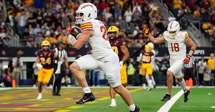 Carson Hansen crossing into the end zone.